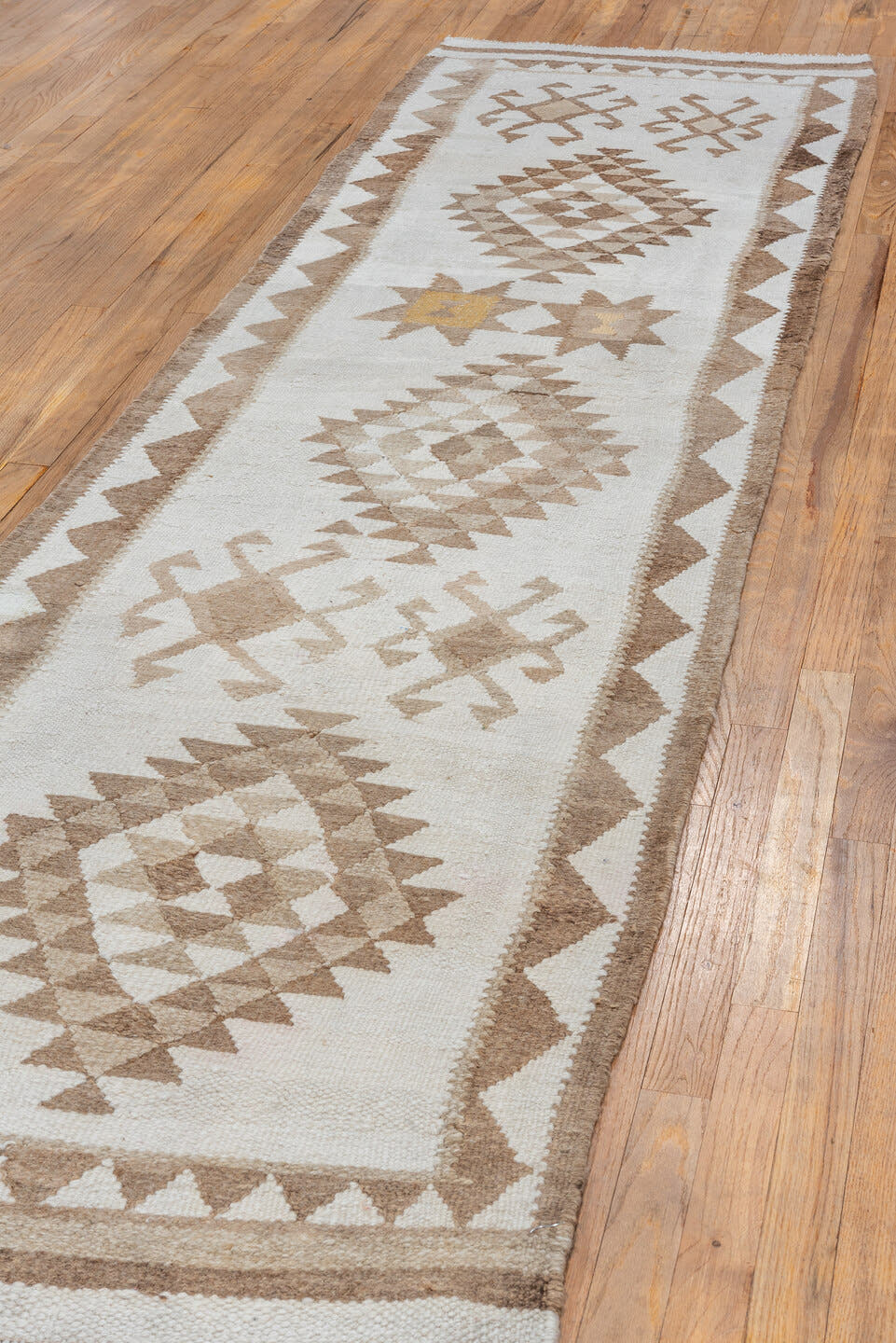 2' x 10' one-of-a-kind handmade antique Kilim runner rug. Color palette: ivory, taupe, camel, beige, sand, gold, gray