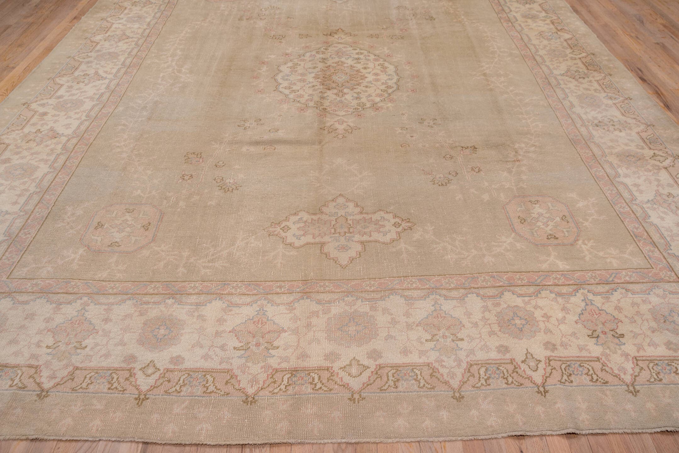 11' x 14' one-of-a-kind handmade antique Oushak oversize rug. Color palette: taupe, ivory, blush, pale blue, beige, sand