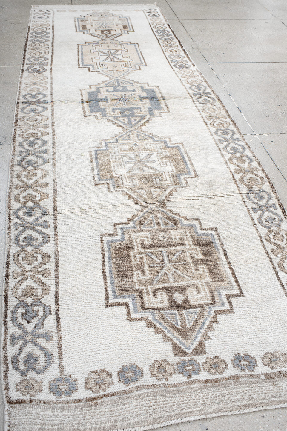 4' x 12' one-of-a-kind handmade vintage Kars runner rug. Color palette: ivory, taupe, brown, gray, beige