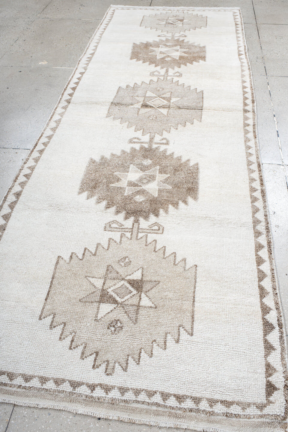 4' x 11' one-of-a-kind handmade vintage Kars runner rug. Color palette: ivory, taupe, beige, camel, gray