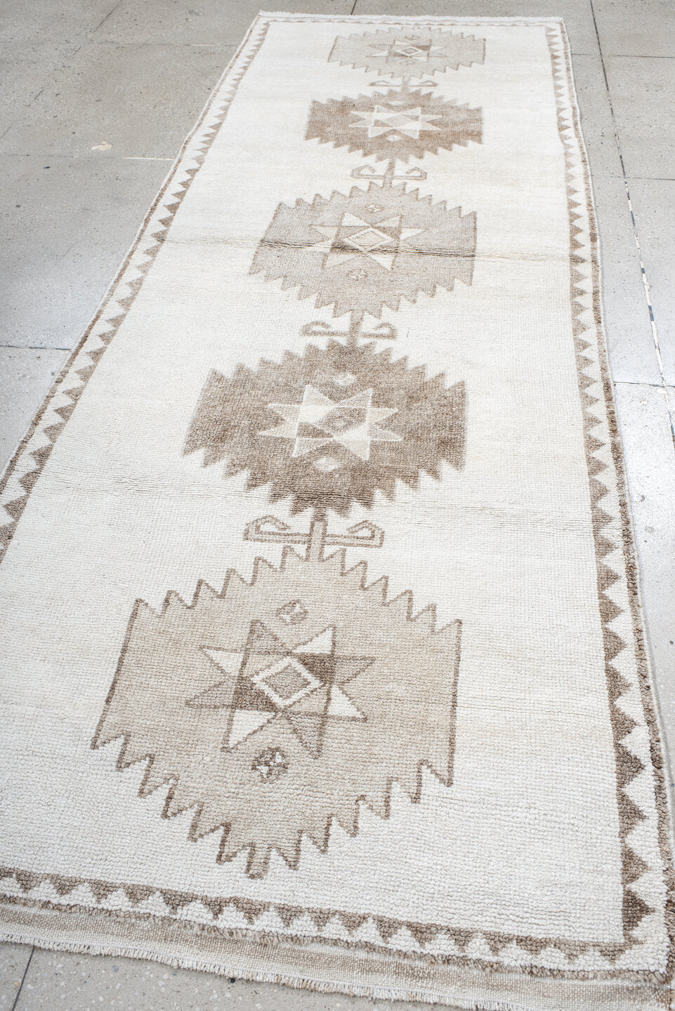 4' x 11' one-of-a-kind handmade vintage Kars runner rug. Color palette: ivory, taupe, beige, camel, gray