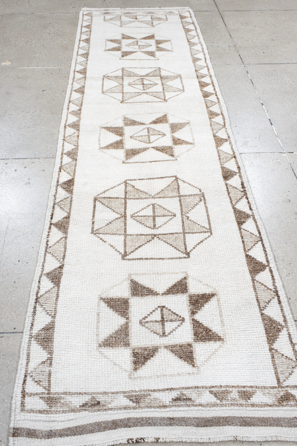 3' x 10' one-of-a-kind handmade vintage Kars runner rug. Color palette: brown, dark gray, gray, light gray, off-white, pink