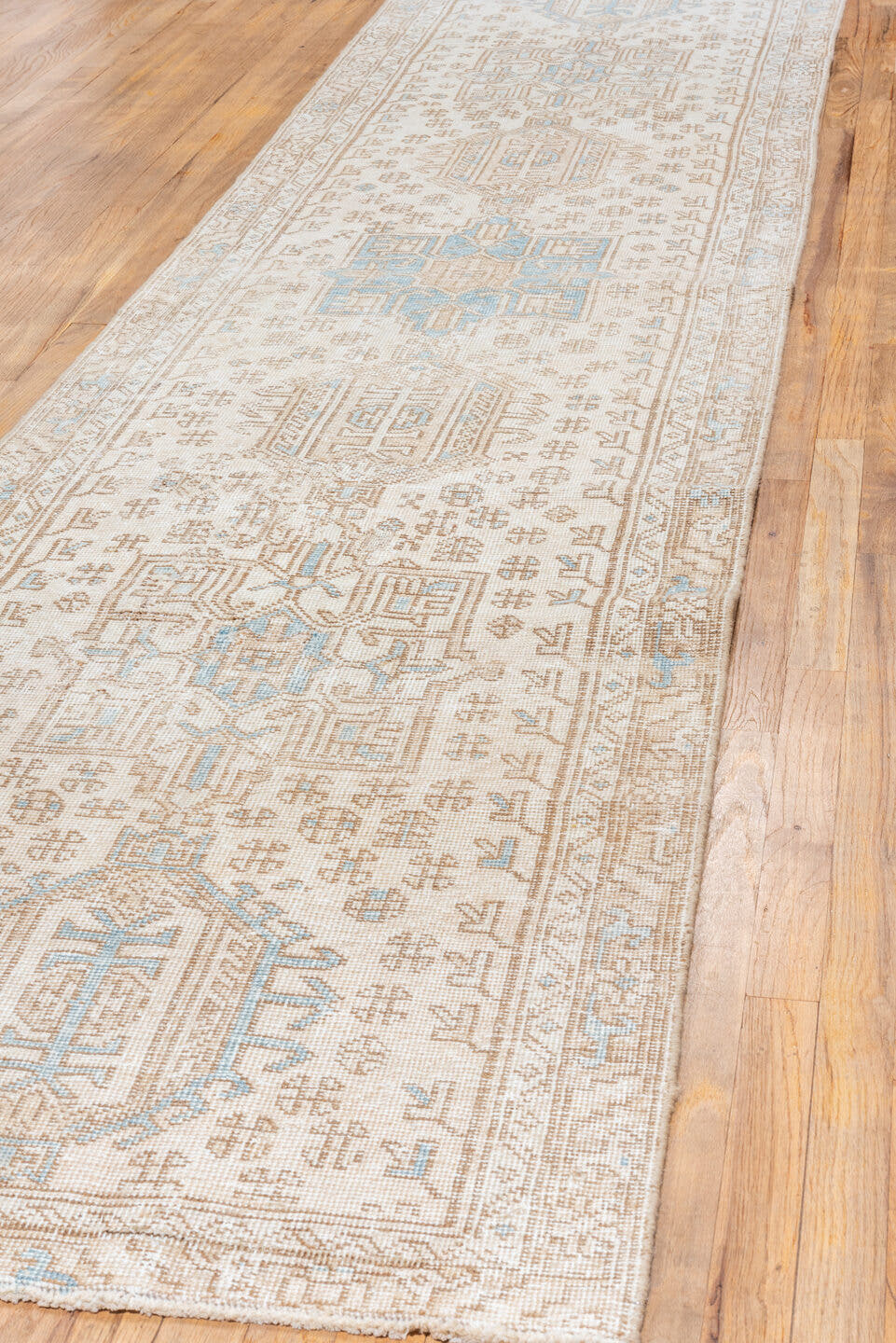 3' x 13' one-of-a-kind handmade antique Karaje runner rug. Color palette: ivory, taupe, sky blue, sand, beige, camel, gray