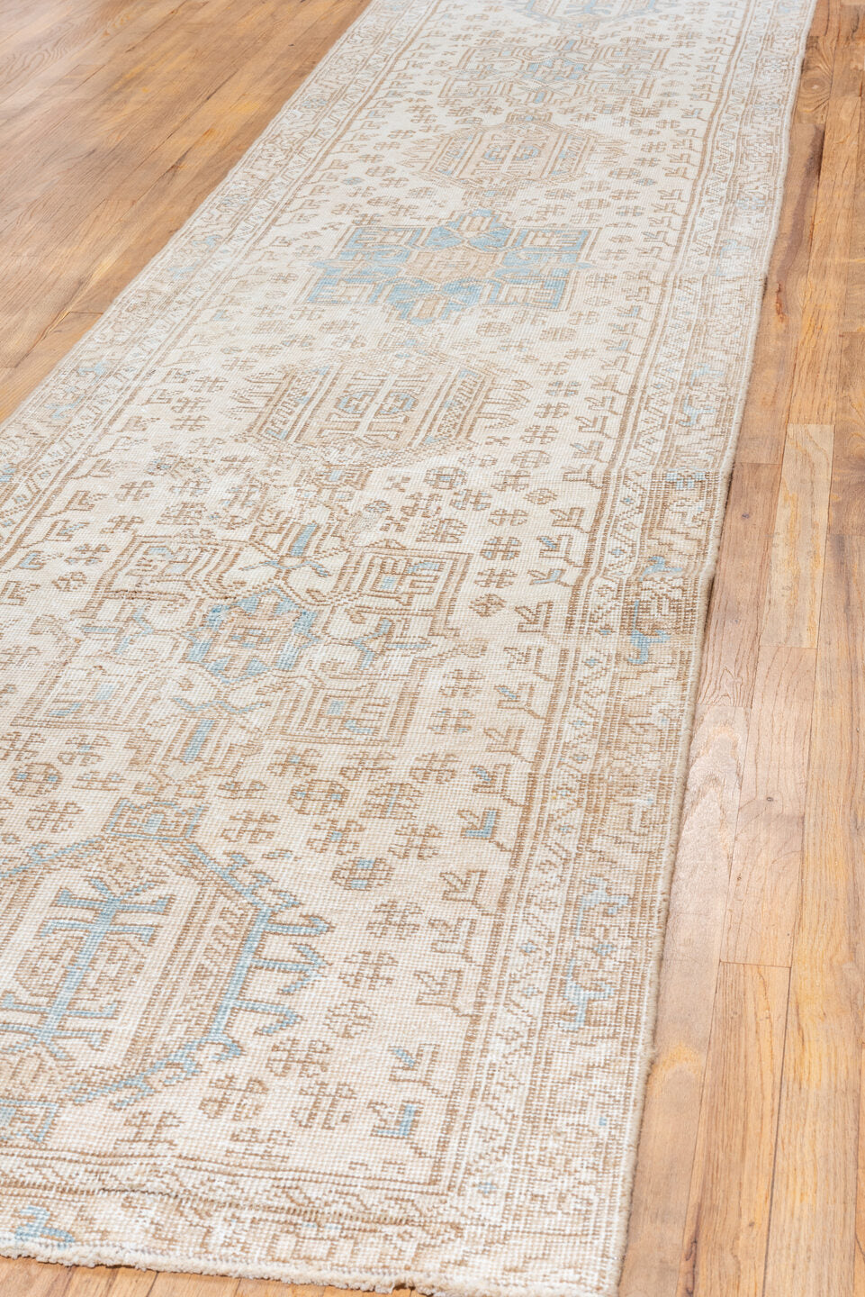3' x 13' one-of-a-kind handmade antique Karaje runner rug. Color palette: ivory, taupe, sky blue, sand, beige, camel, gray
