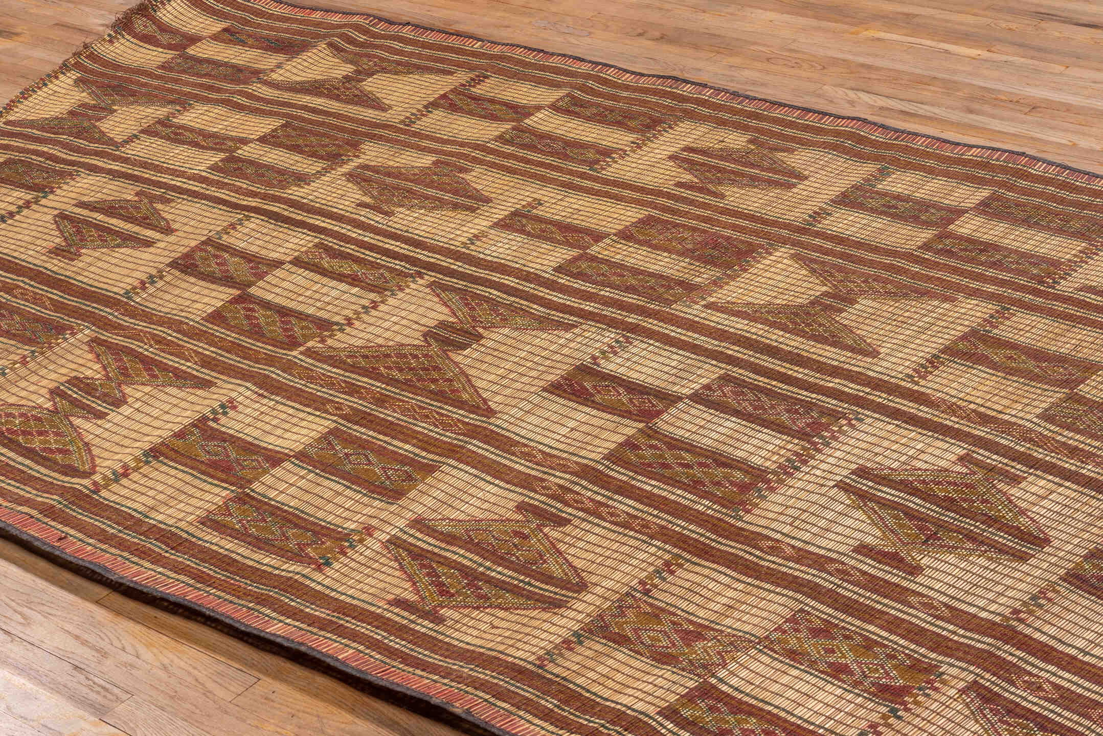 6' x 10' one-of-a-kind handmade vintage Tuareg large size rug. Color palette: brown, off-white, orange, peach puff, tan