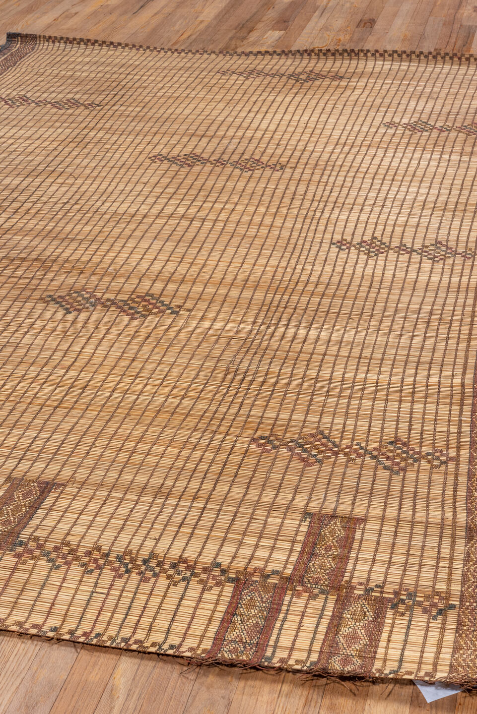 6' x 8' one-of-a-kind handmade vintage Tuareg medium size rug. Color palette: black, brown, gray, off-white, orange