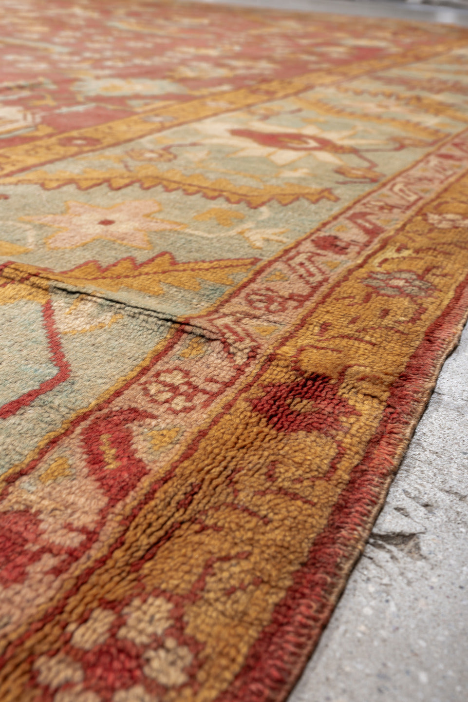 13' x 13' one-of-a-kind handmade antique Oushak oversize rug. Color palette: terracotta, aqua, gold, ivory, camel, sage