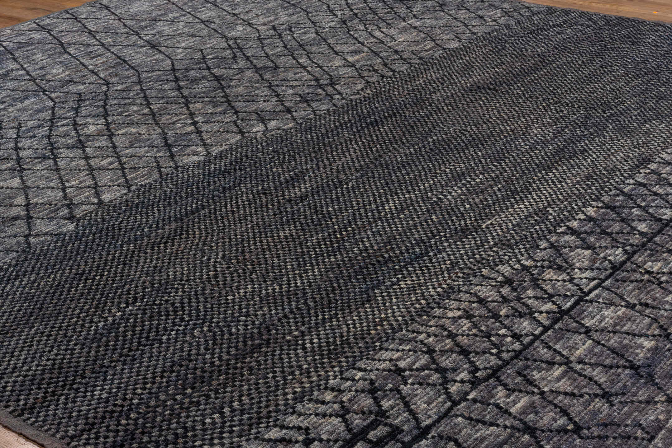 12' x 15' one-of-a-kind handmade vintage Tulu oversize rug. Color palette: charcoal, slate, gray, taupe, ebony, black, beige