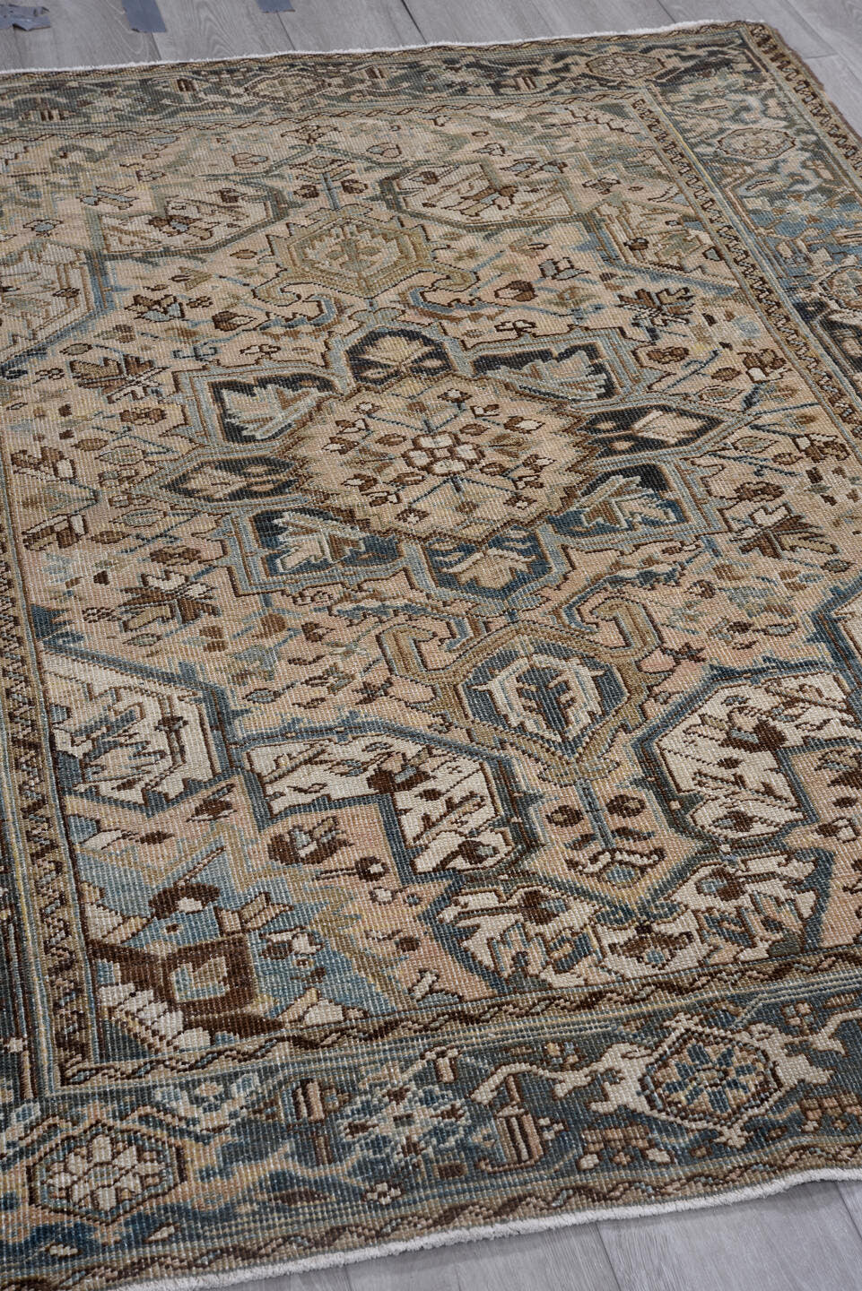 4' x 6' one-of-a-kind handmade vintage Heriz rug. Color palette: ivory, slate, taupe, sky blue, charcoal, brown, gray, beige