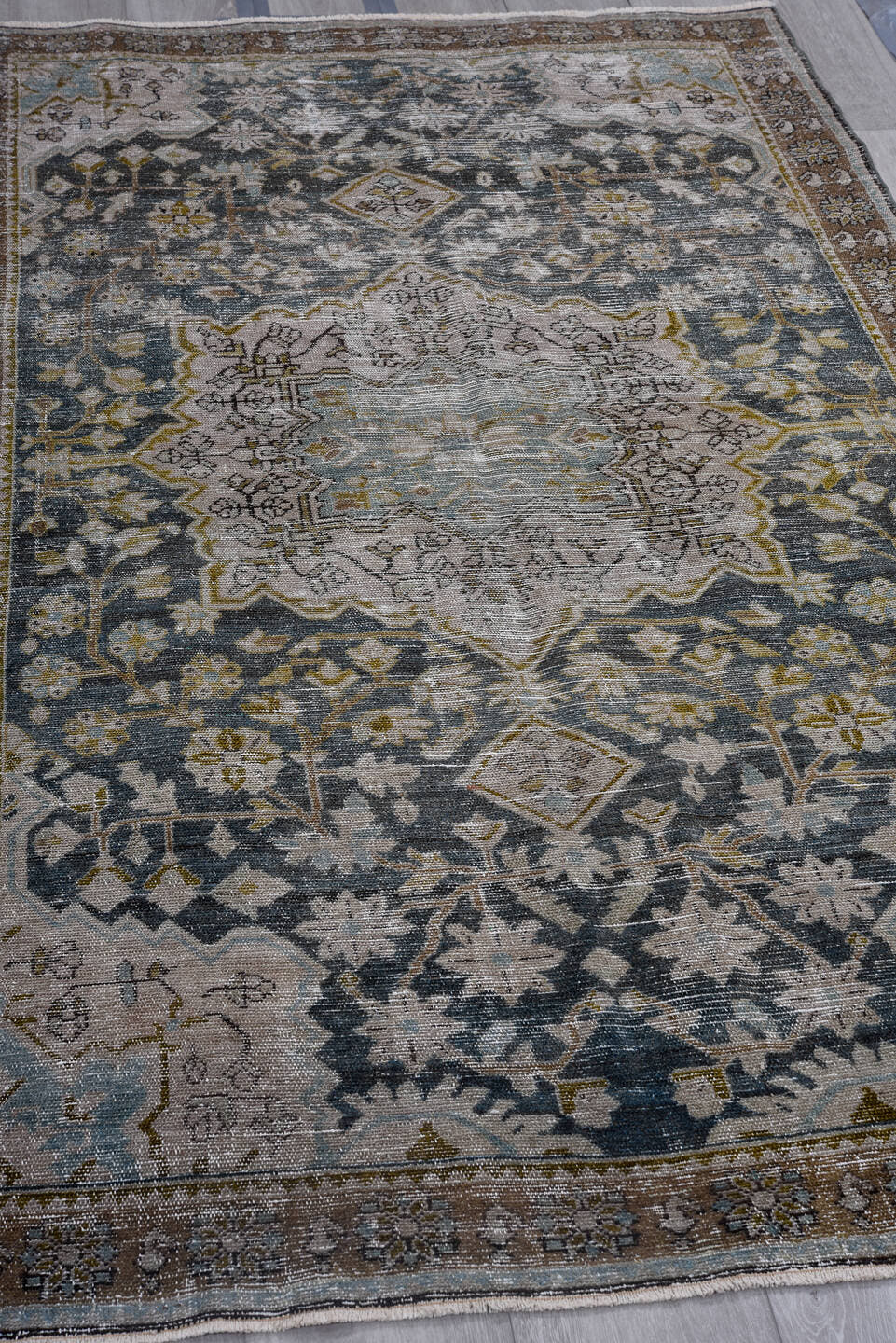 4' x 7' one-of-a-kind handmade antique Malayer rug. Color palette: ivory, indigo, brown, sky blue, taupe, olive, purple