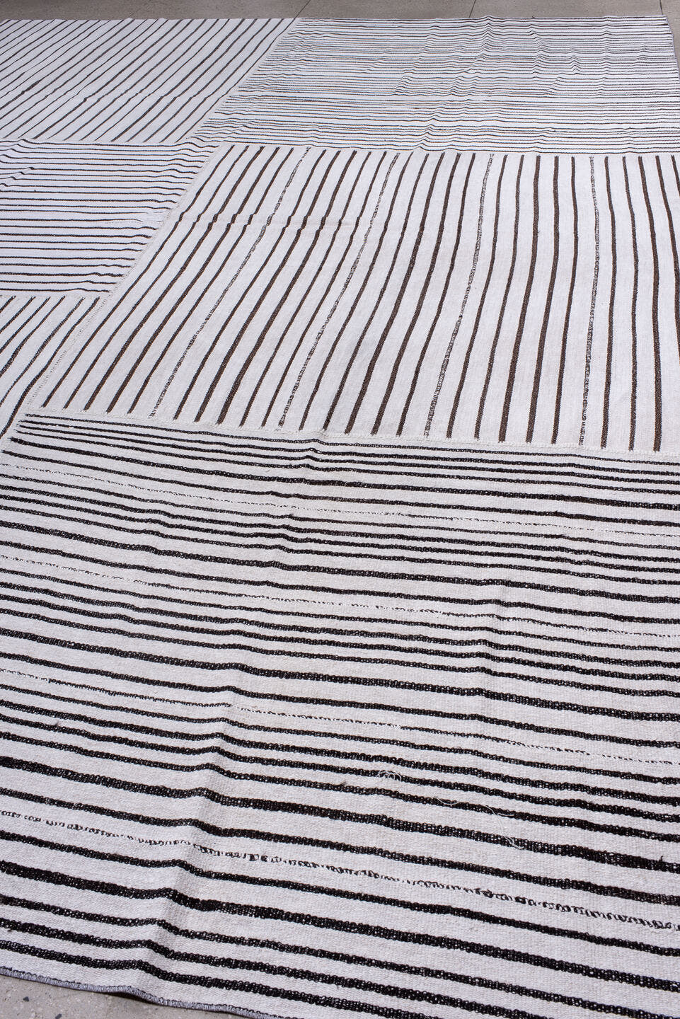11' x 16' one-of-a-kind handmade antique Flatweave oversize rug. Color palette: ivory, charcoal, gray, black