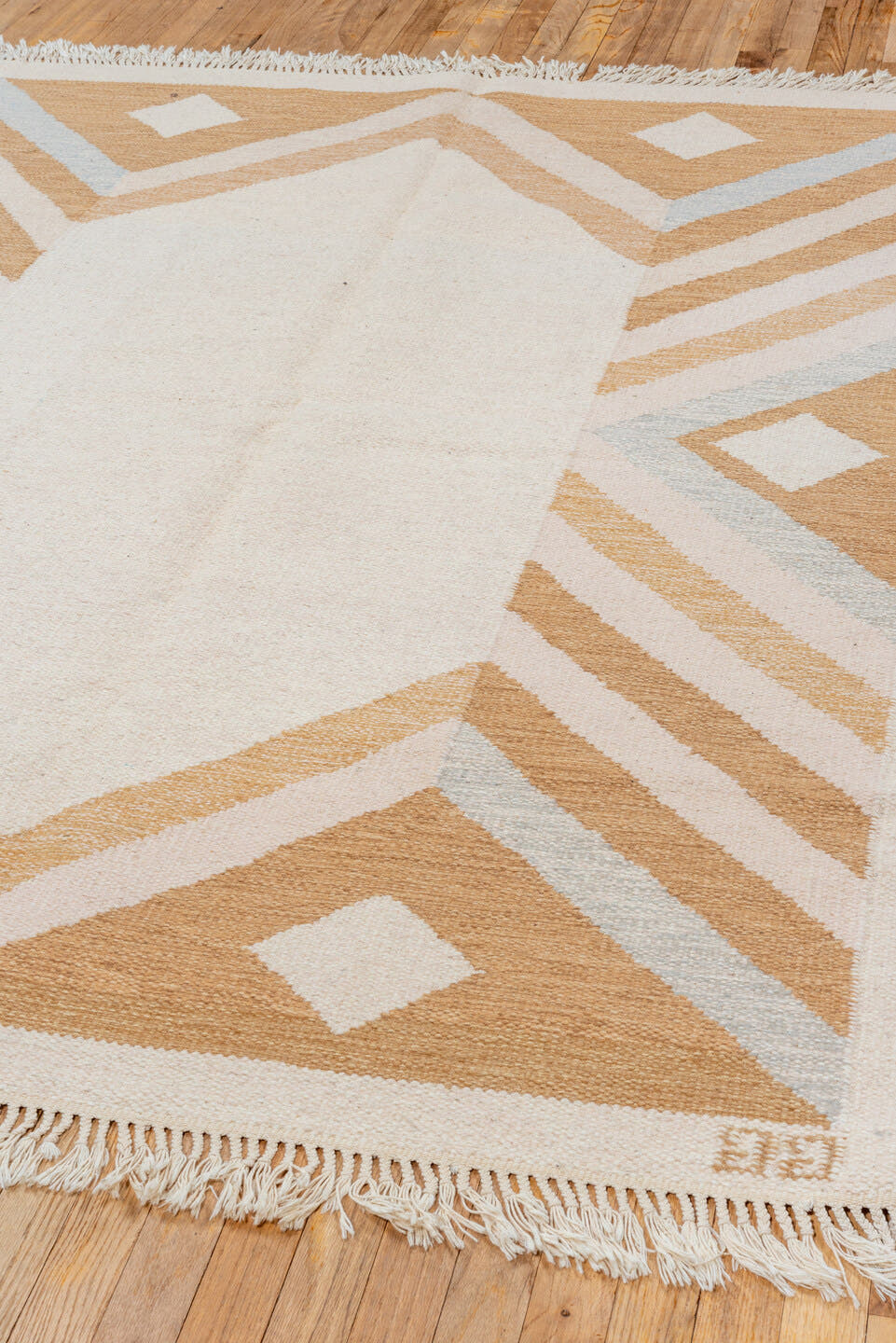 5' x 7' one-of-a-kind handmade vintage Rollaken rug. Color palette: ivory, camel, cream, pale_blue, beige, light blue