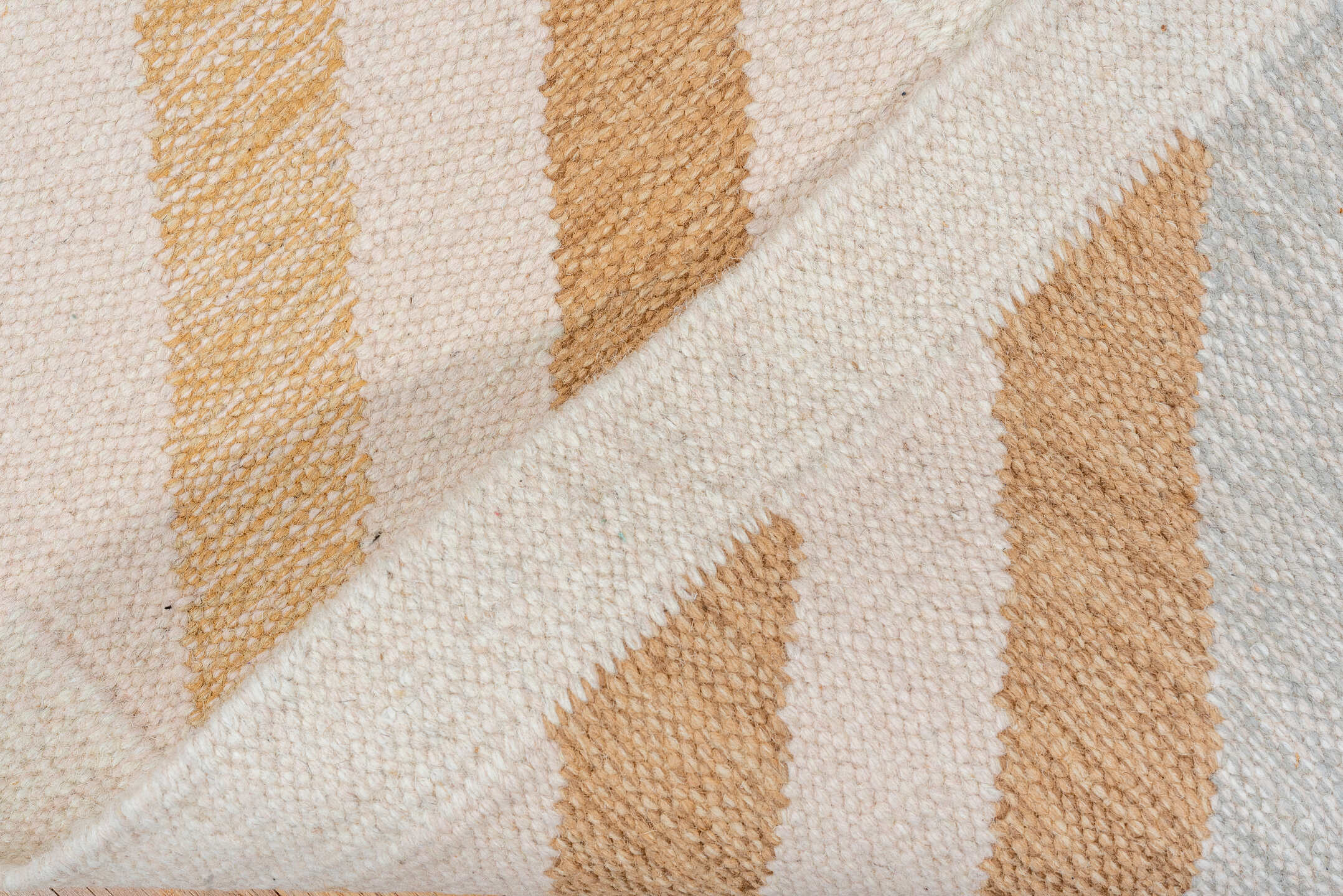5' x 7' one-of-a-kind handmade vintage Rollaken rug. Color palette: ivory, camel, cream, pale_blue, beige, light blue