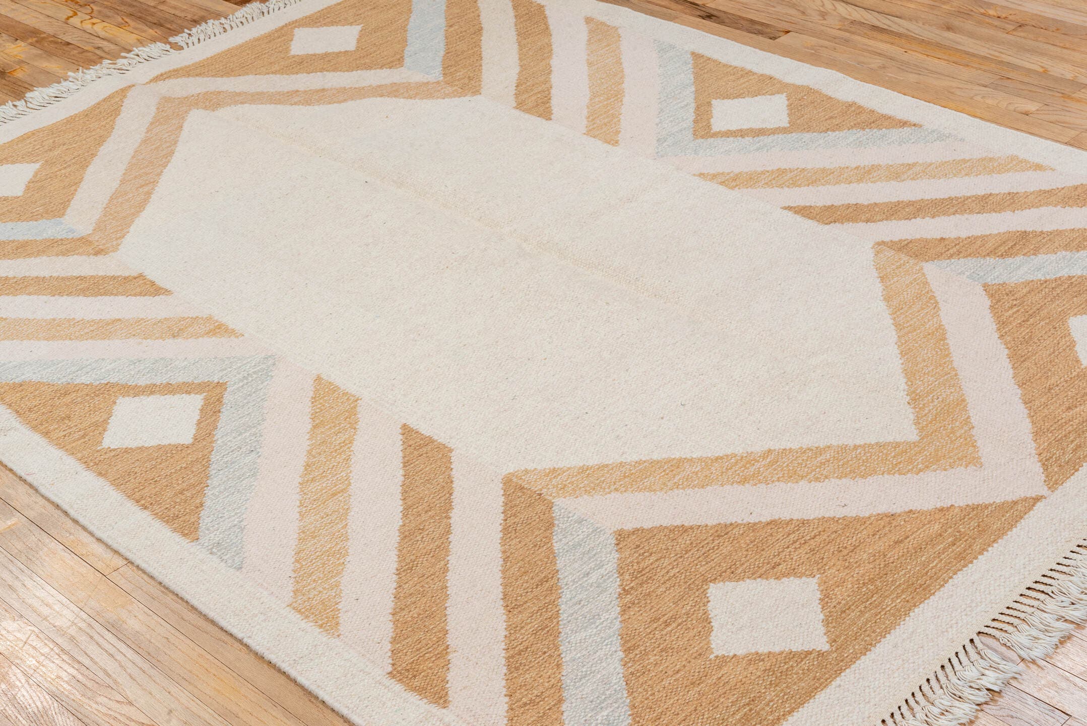 5' x 7' one-of-a-kind handmade vintage Rollaken rug. Color palette: ivory, camel, cream, pale_blue, beige, light blue