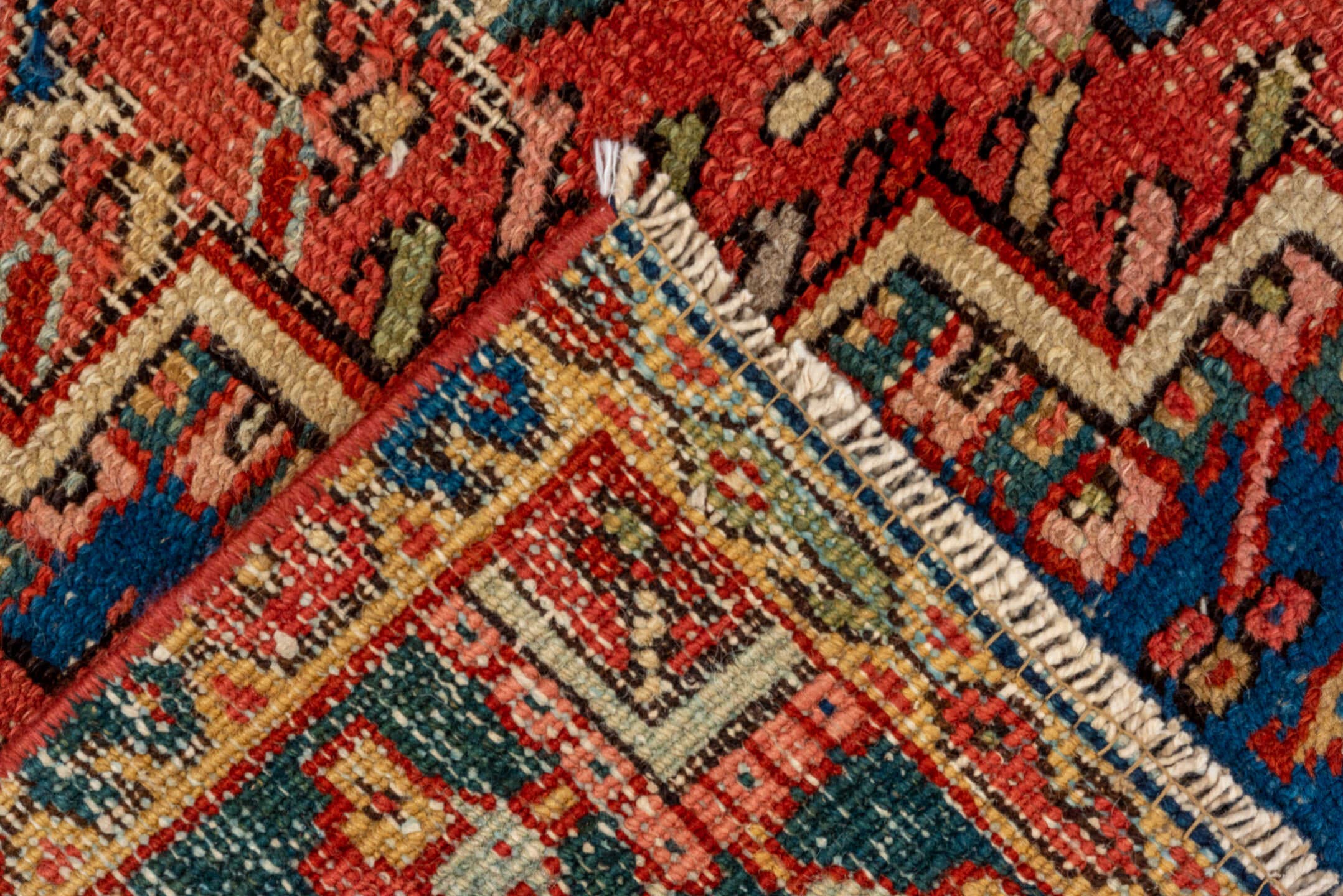 5' x 8' one-of-a-kind handmade vintage Heriz medium size rug. Color palette: coral, navy, sky blue, ivory, rust, sage, camel