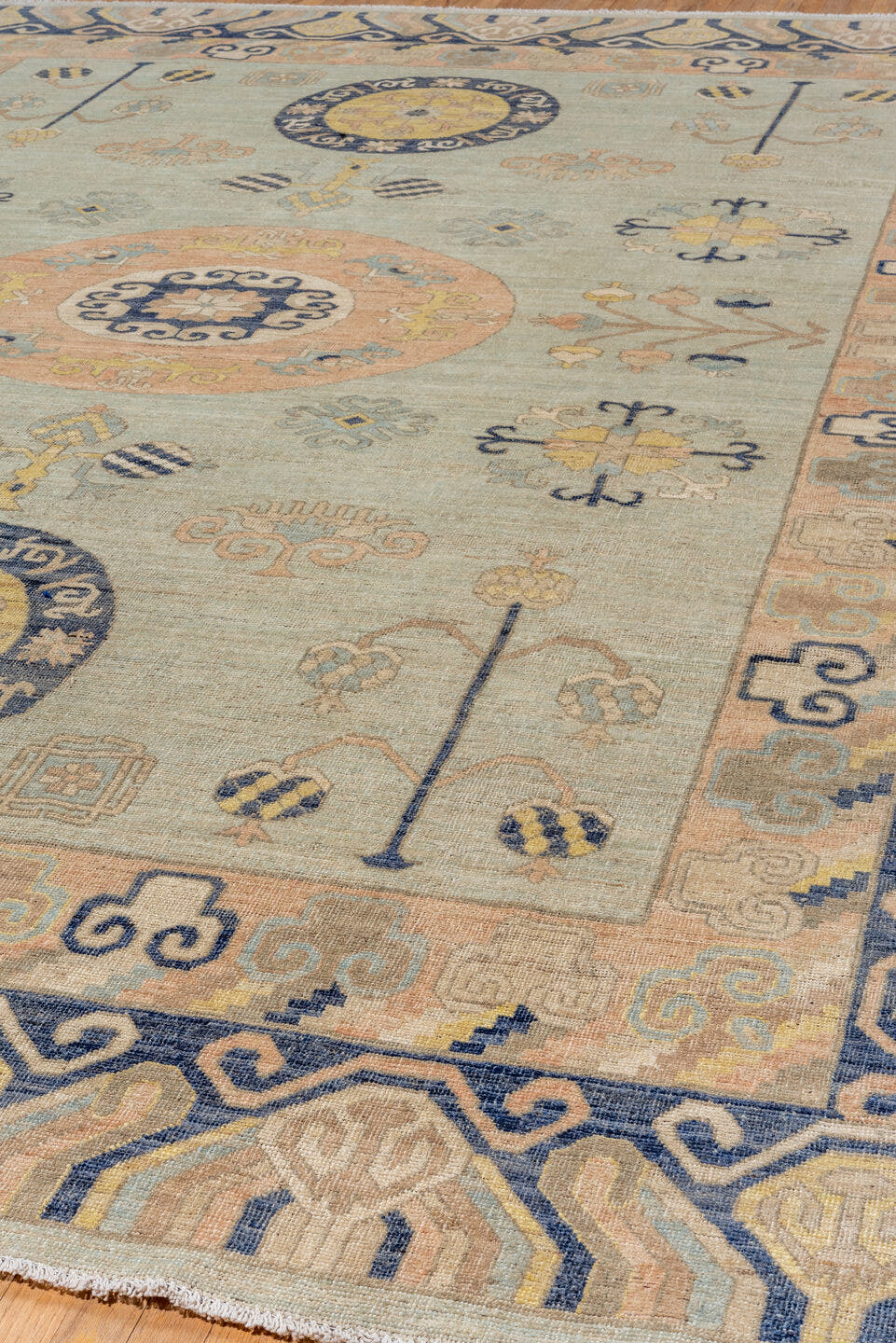 10' x 14' one-of-a-kind handmade vintage Khotan large size rug. Color palette: pale blue, ivory, navy, blush, beige, gold