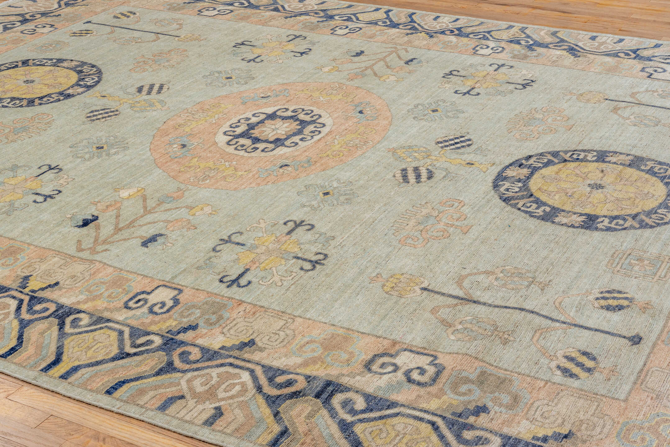 10' x 14' one-of-a-kind handmade vintage Khotan large size rug. Color palette: pale blue, ivory, navy, blush, beige, gold
