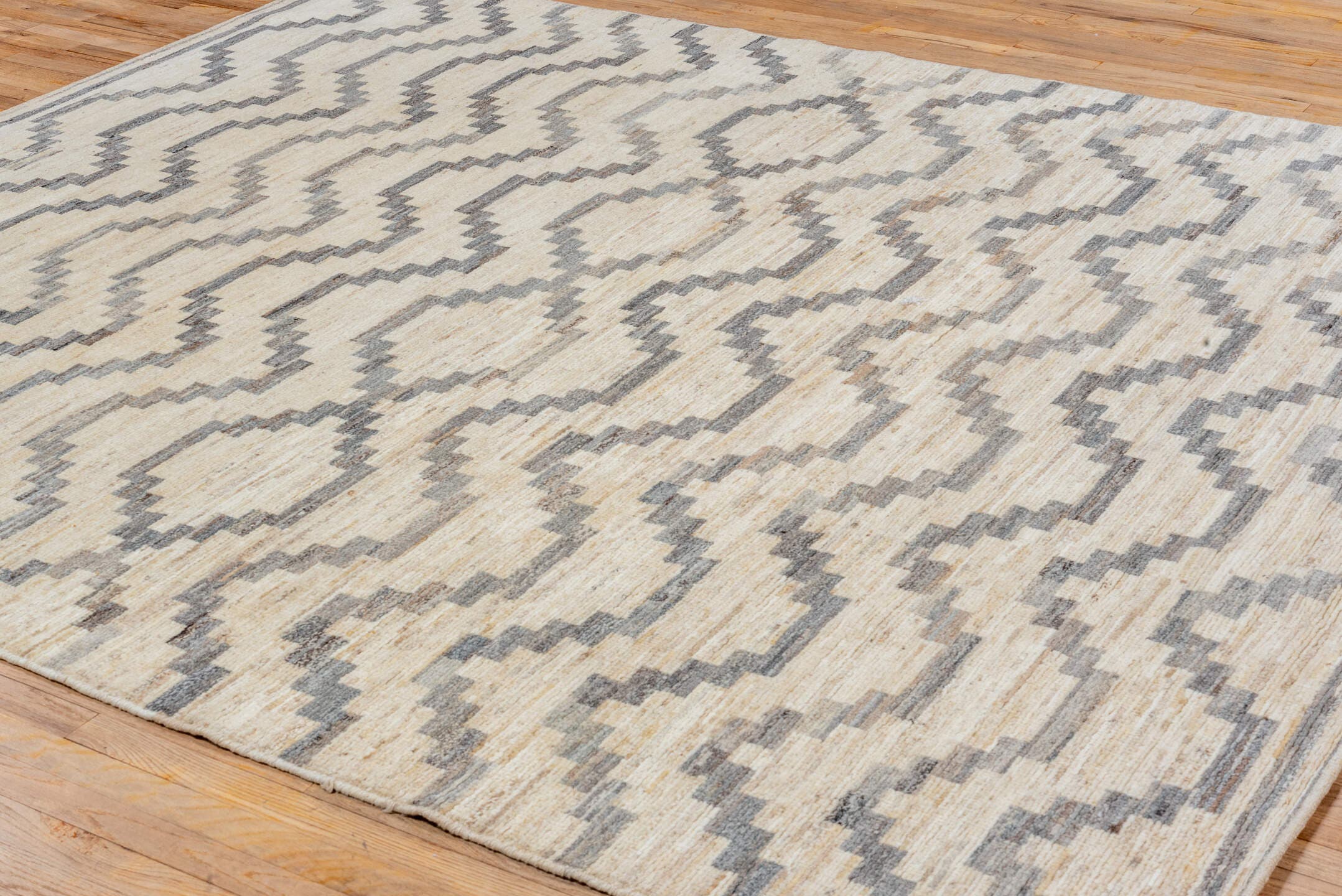 8' x 9' one-of-a-kind handmade vintage Afghan rug. Color palette: ivory, gray, charcoal, cream, taupe, black, beige