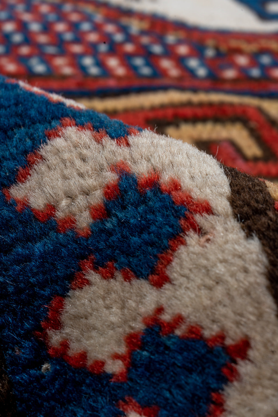 5' x 7' one-of-a-kind handmade vintage Kazak rug. Color palette: blue, brown, gray, pink, red