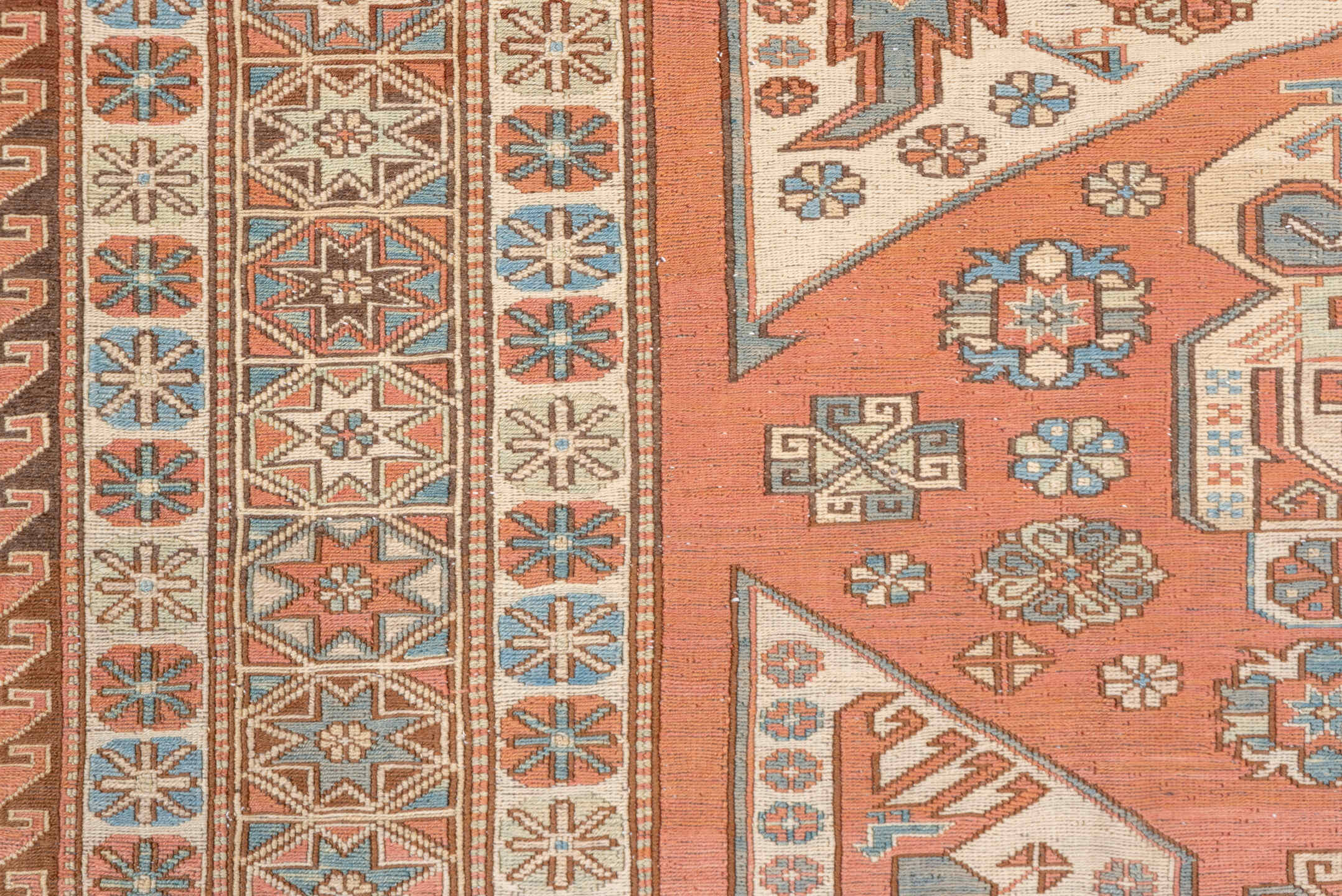 7' x 9' one-of-a-kind handmade vintage Sumak rug. Color palette: salmon, ivory, dusty blue, taupe, rust, beige, pink, blue