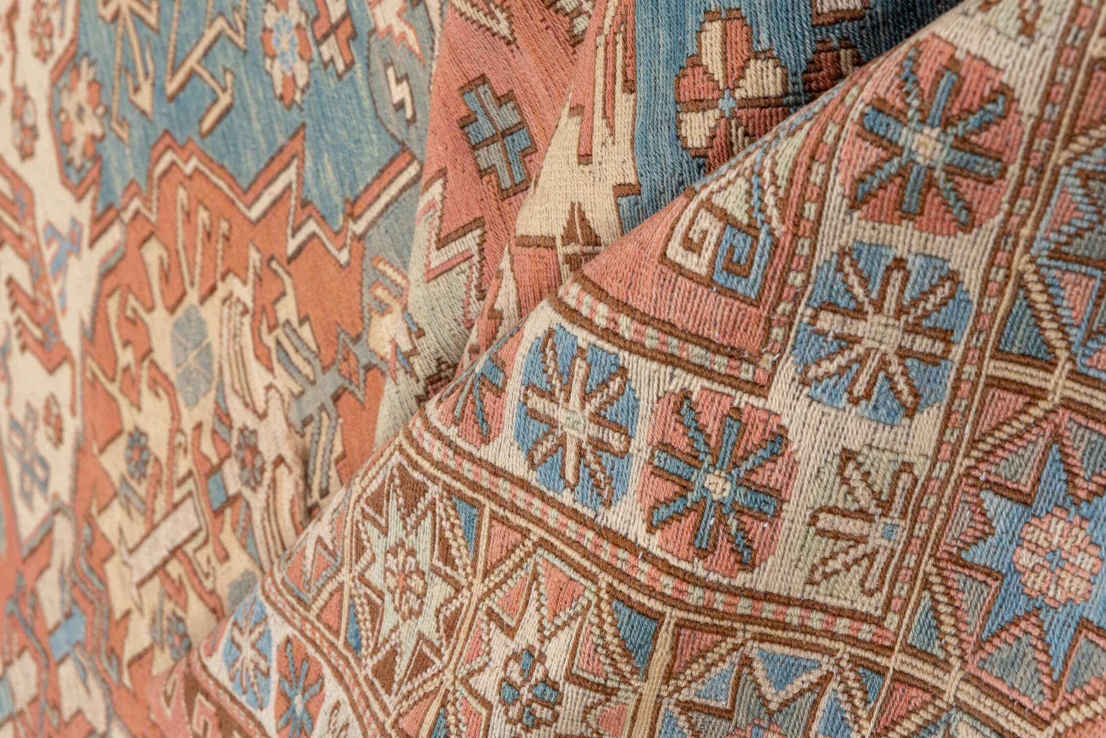 7' x 9' one-of-a-kind handmade vintage Sumak rug. Color palette: salmon, ivory, dusty blue, taupe, rust, beige, pink, blue
