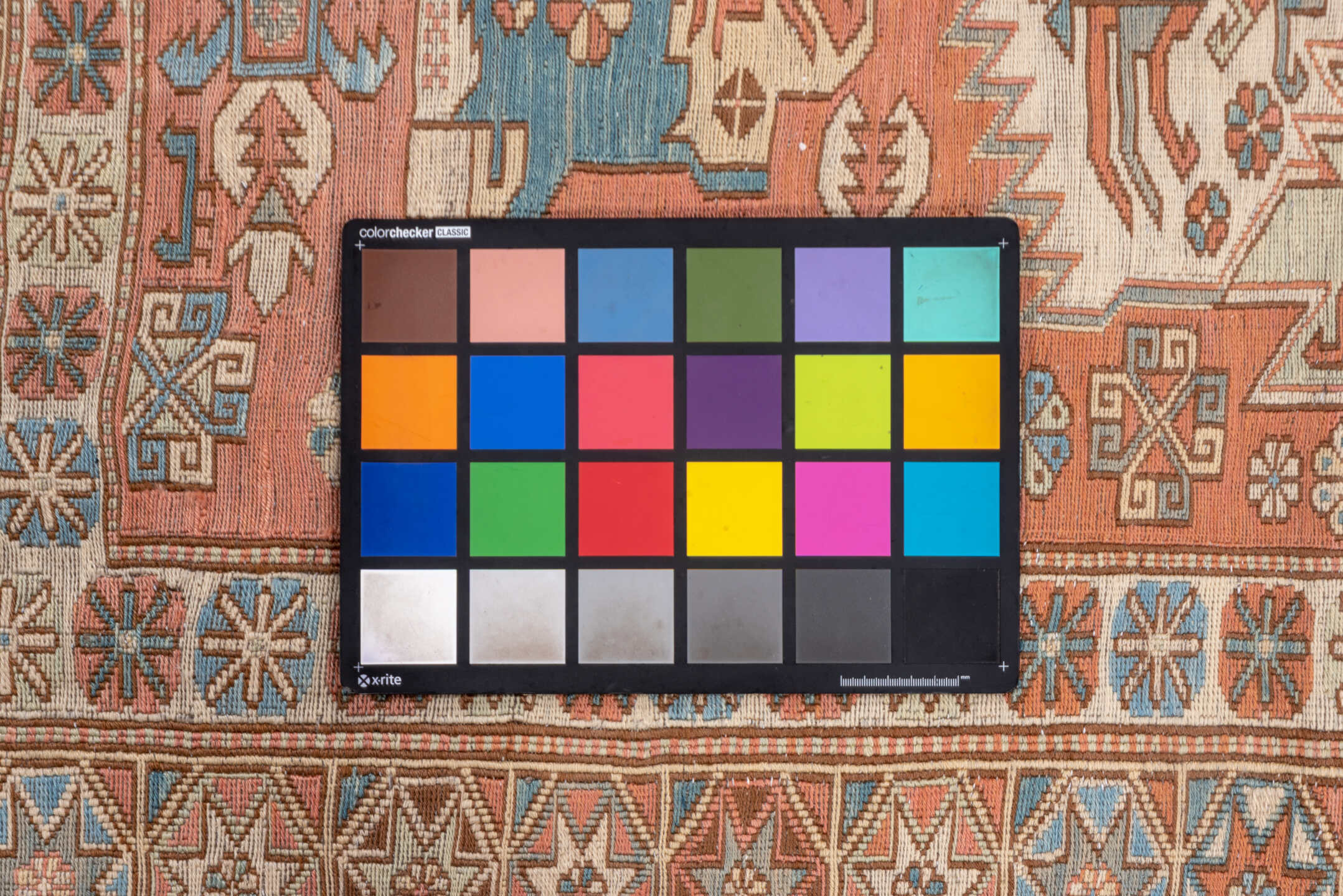 7' x 9' one-of-a-kind handmade vintage Sumak rug. Color palette: brown, gray, orange, pink