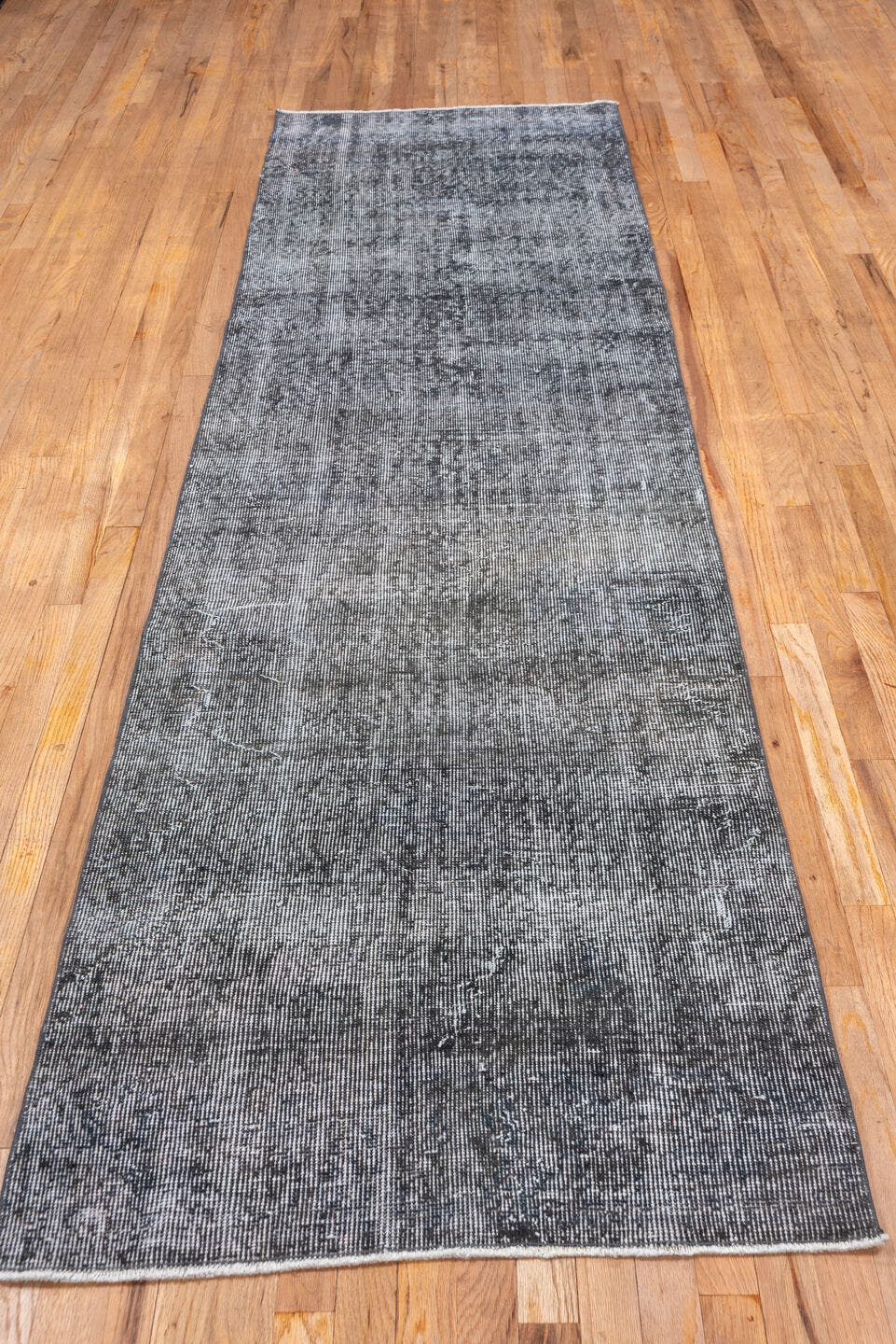 2' x 10' one-of-a-kind handmade vintage Overdyed runner rug. Color palette: gray, charcoal, ivory, taupe, black, beige