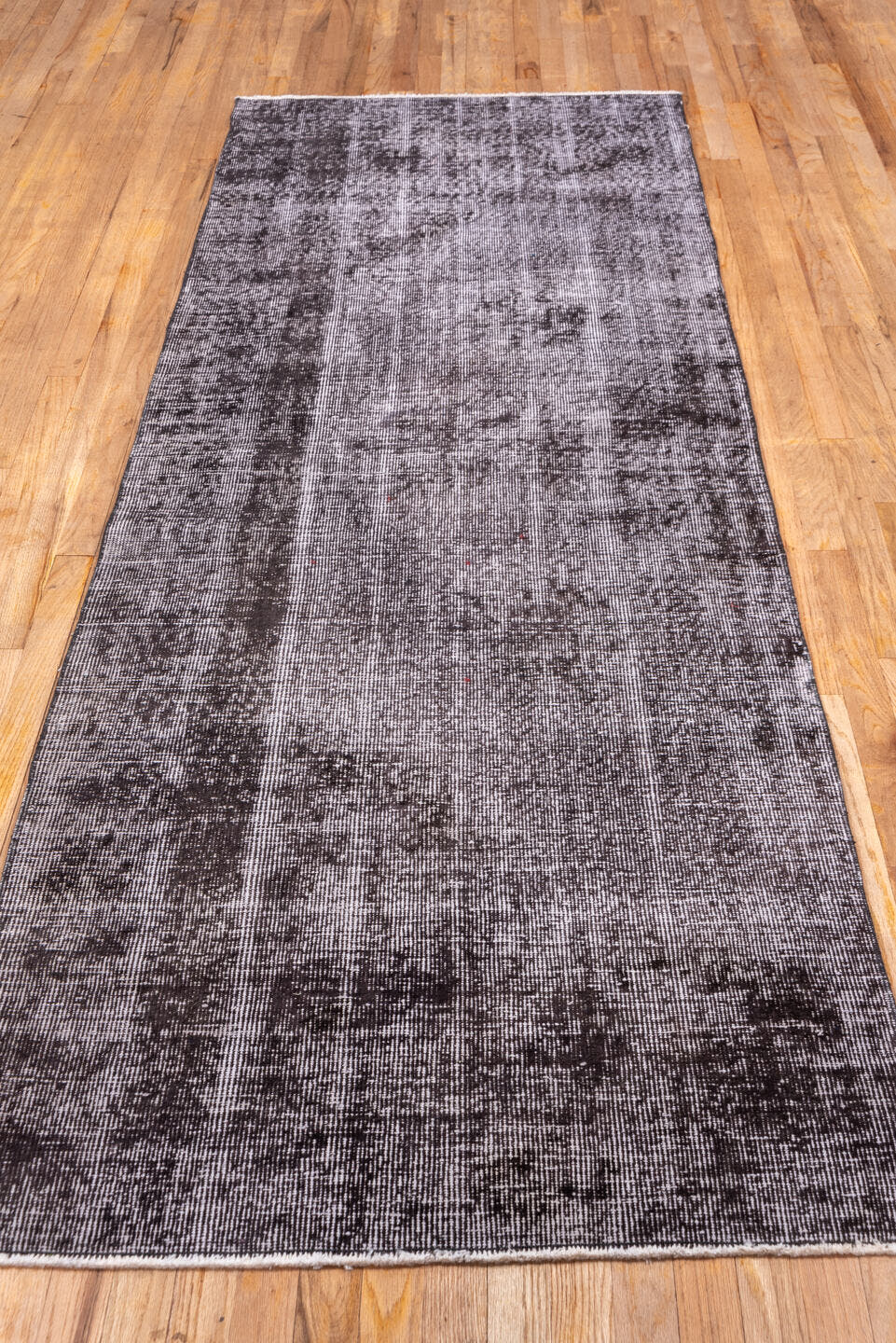3' x 9' one-of-a-kind handmade vintage Overdyed runner rug. Color palette: plum, charcoal, taupe, mauve, brown, pink, purple