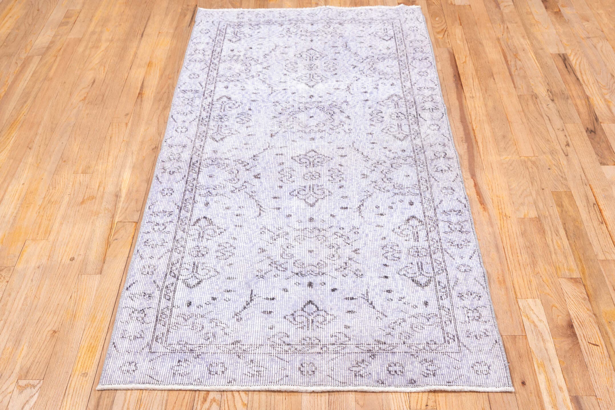3' x 6' one-of-a-kind handmade vintage Overdyed runner rug. Color palette: lavender, ivory, taupe, dusty rose, light gray