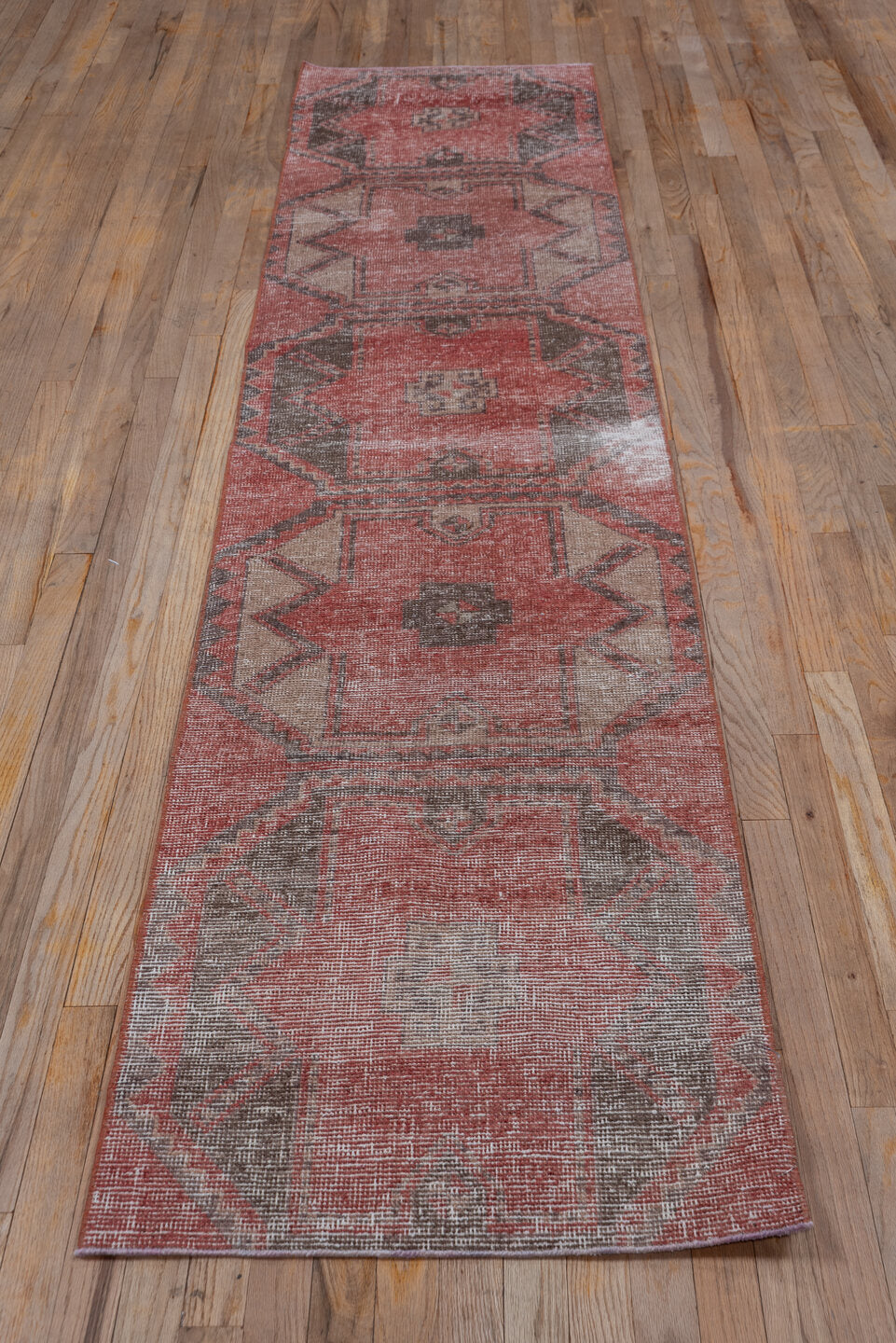 2' x 10' one-of-a-kind handmade vintage Oushak runner rug. Color palette: brown, gray, light gray, off-white, pink, red