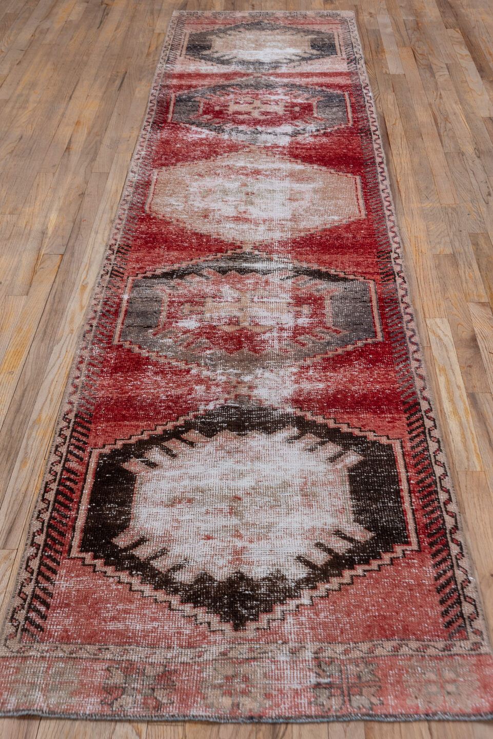 2' x 11' one-of-a-kind handmade vintage Oushak runner rug. Color palette: brown, gray, light gray, pink, red