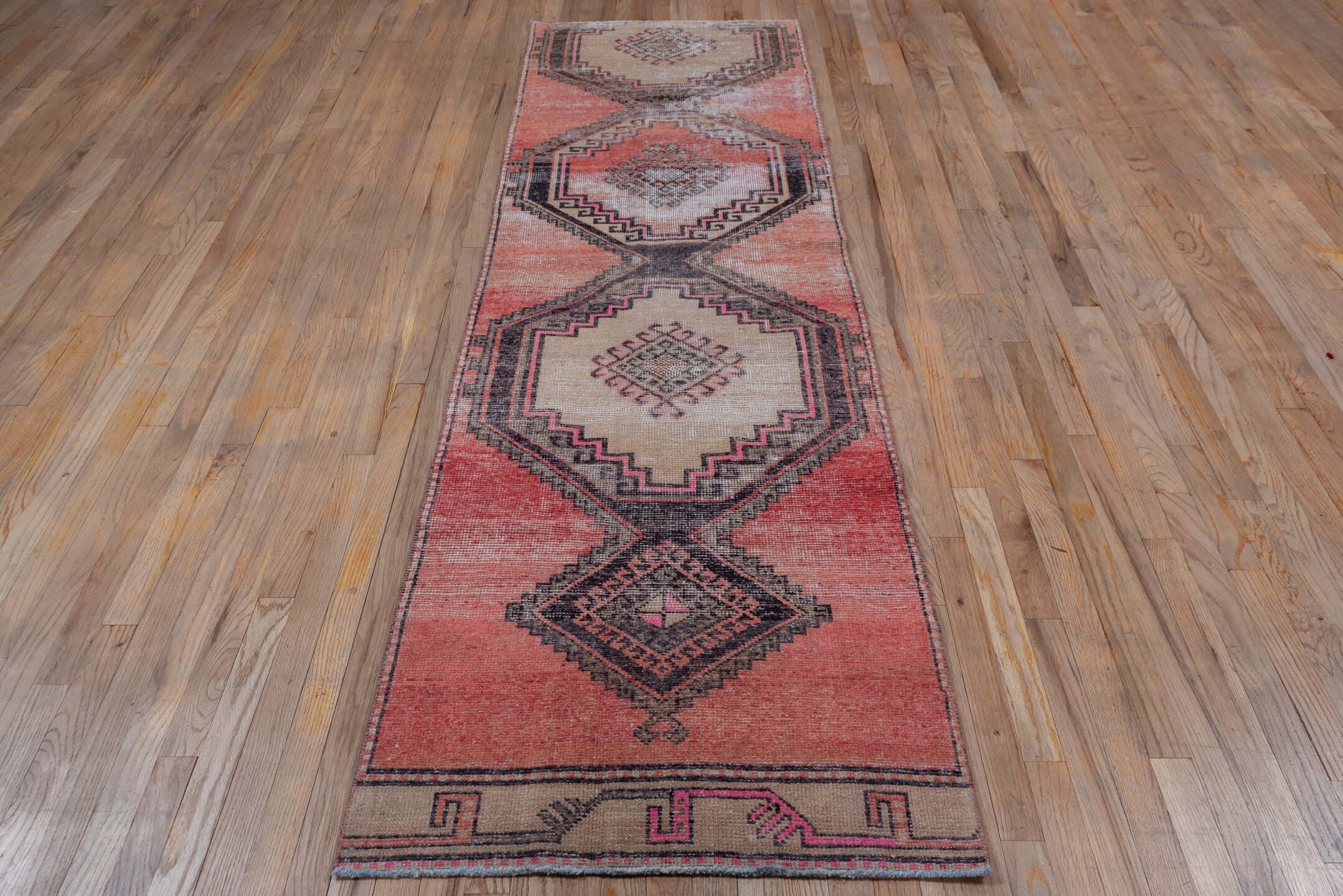 2' x 9' one-of-a-kind handmade vintage Oushak runner rug. Color palette: terra cotta, ivory, charcoal, rose, taupe, burgundy