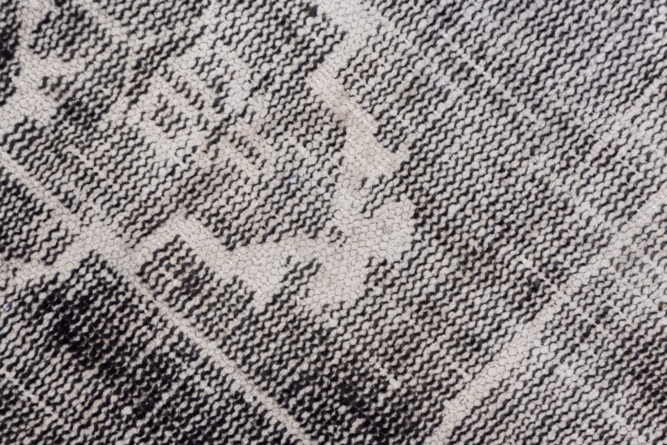 7' x 9' one-of-a-kind handmade vintage Overdyed rug. Color palette: charcoal, ivory, taupe, slate, gray, black, beige