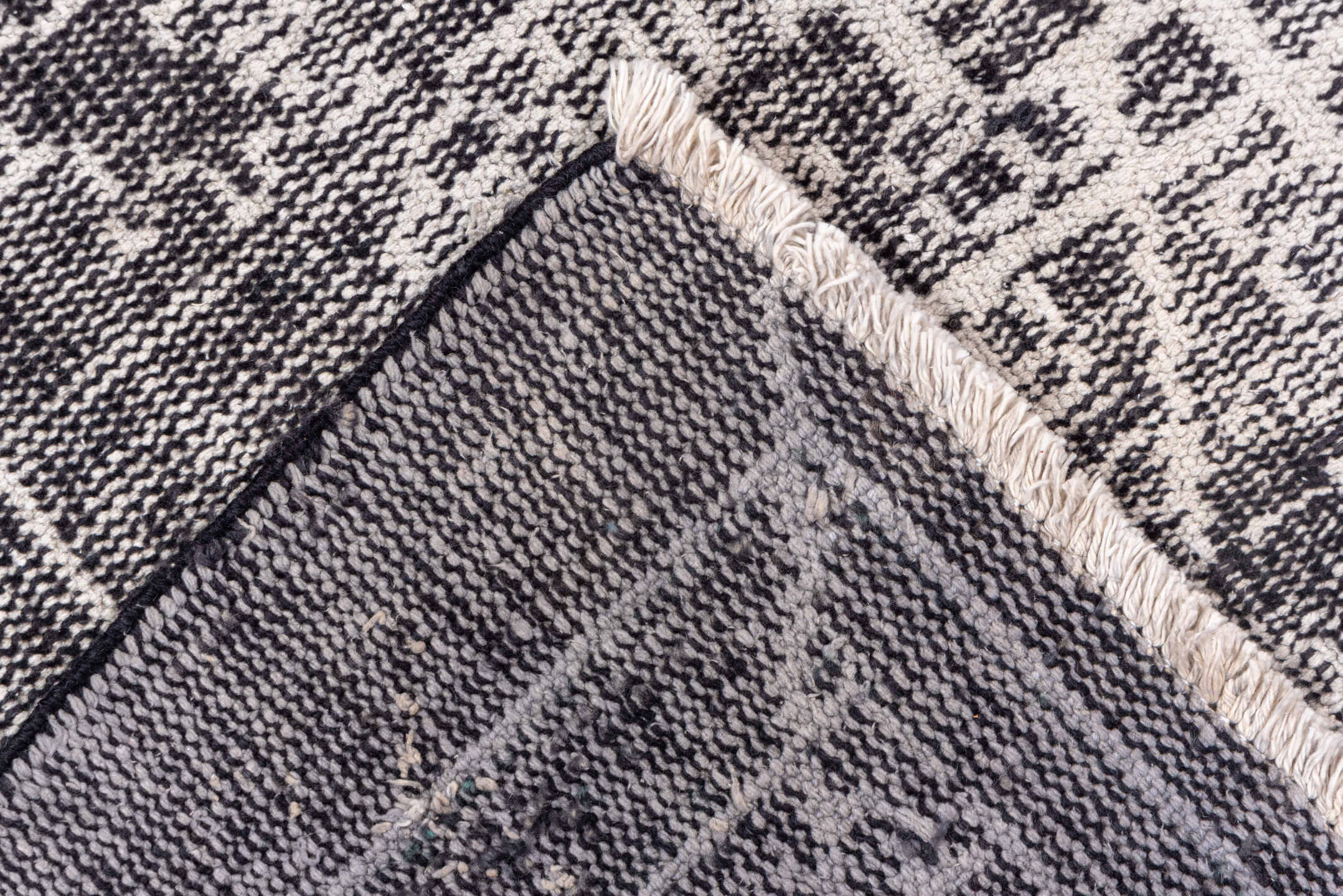 7' x 9' one-of-a-kind handmade vintage Overdyed rug. Color palette: charcoal, ivory, taupe, slate, gray, black, beige