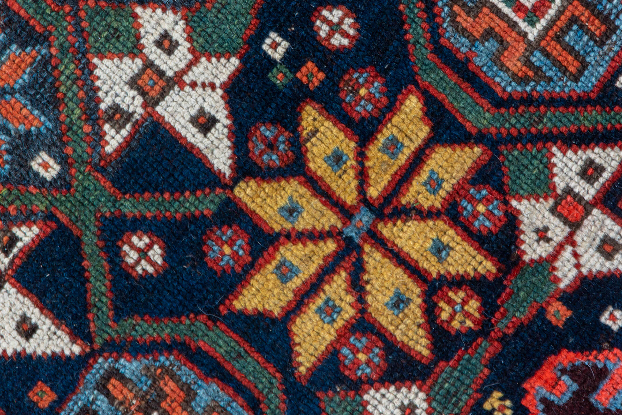 5' x 11' one-of-a-kind handmade vintage Baktiary rug. Color palette: navy, rust, ivory, indigo, gold, terra cotta, brown