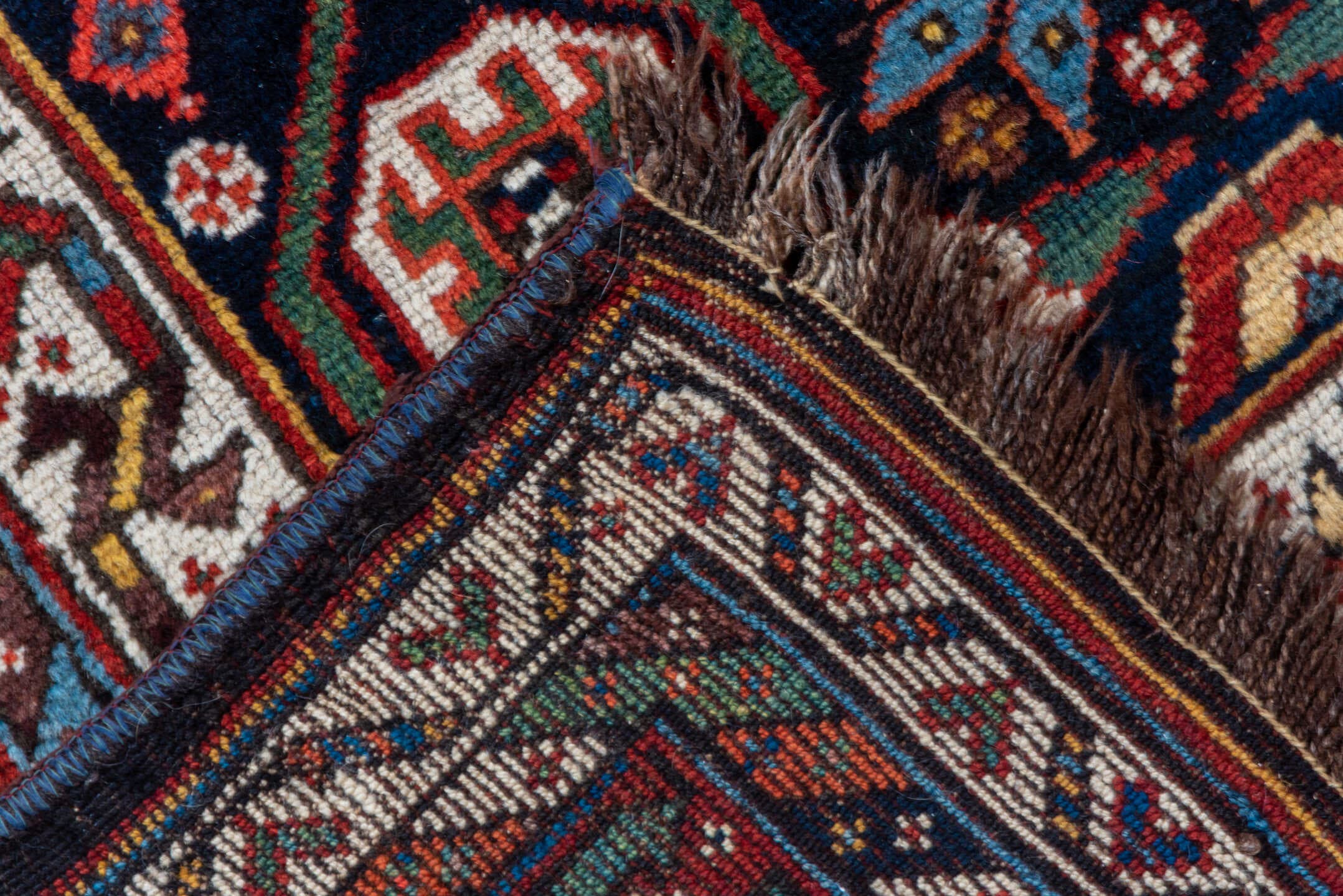 5' x 11' one-of-a-kind handmade vintage Baktiary rug. Color palette: navy, rust, ivory, indigo, gold, terra cotta, brown