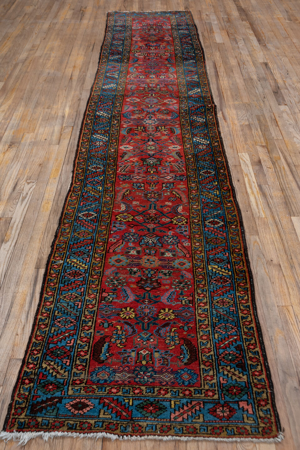 2' x 13' one-of-a-kind handmade vintage Heriz runner rug. Color palette: black, blue, brown, fiord, gray, indian red, pink
