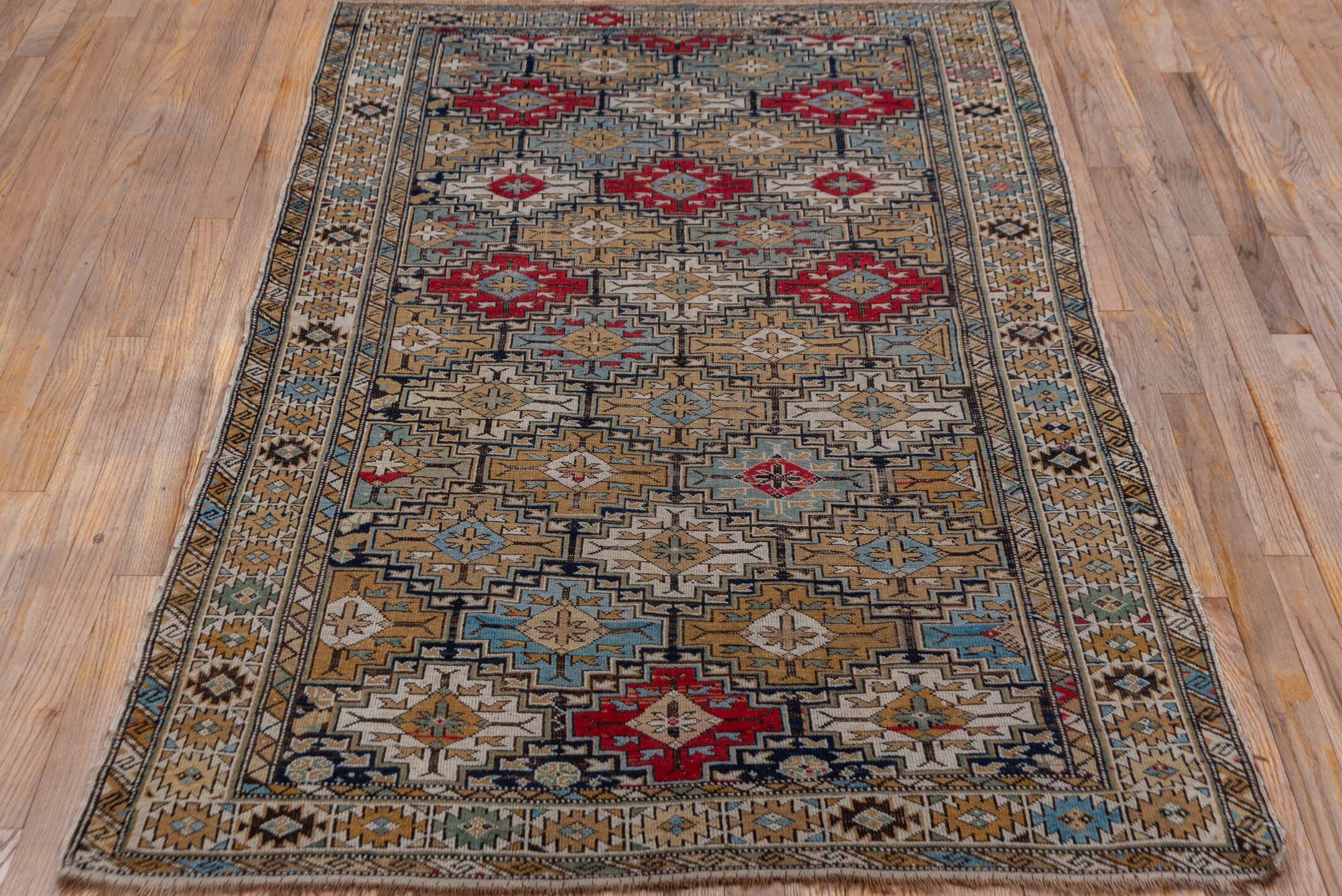 3' x 6' one-of-a-kind handmade vintage Shirvan small size rug. Color palette: taupe, camel, ivory, sky blue, crimson, navy