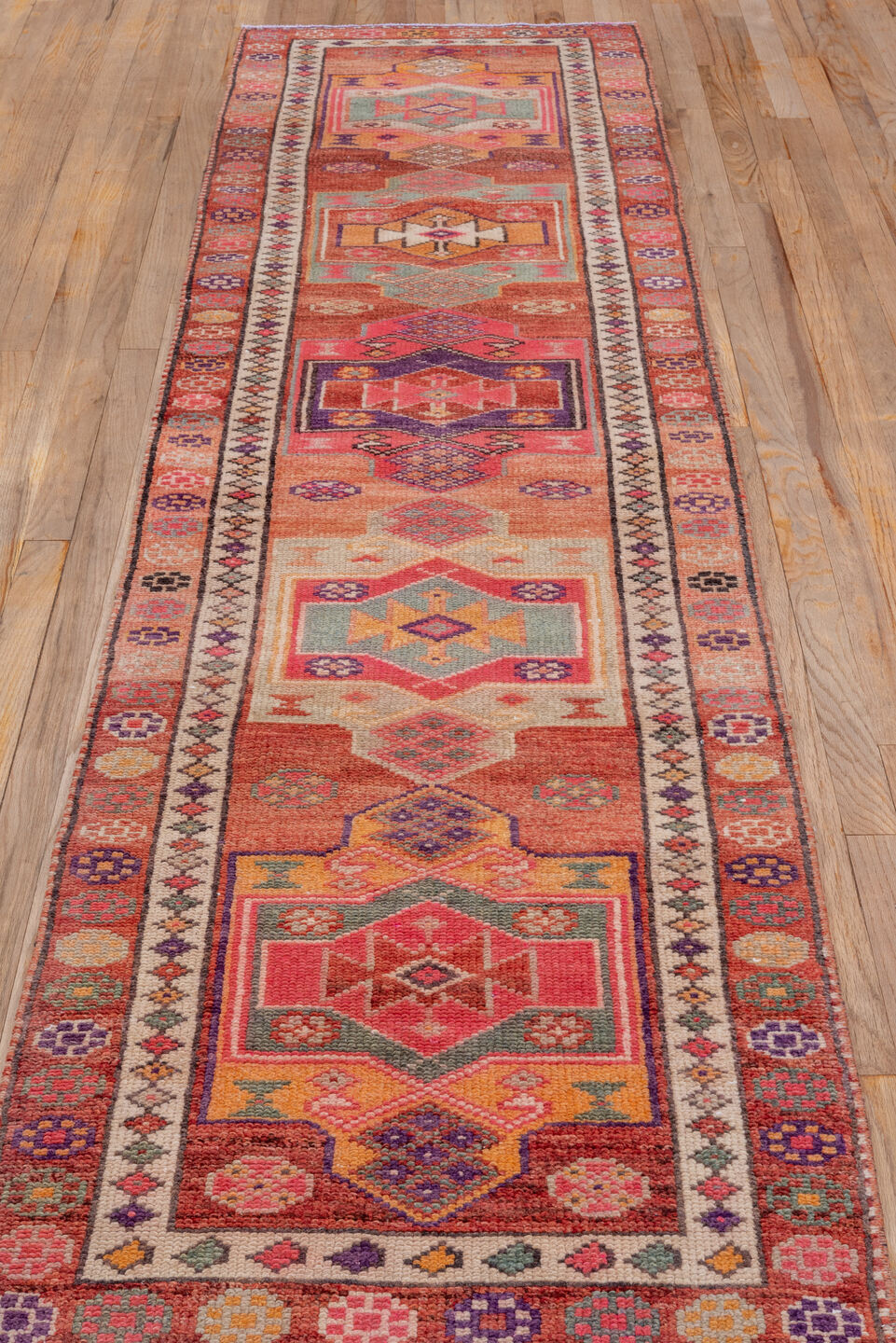 2' x 10' one-of-a-kind handmade vintage Oushak runner rug. Color palette: rose, rust, peach, ivory, plum, terra cotta, sage