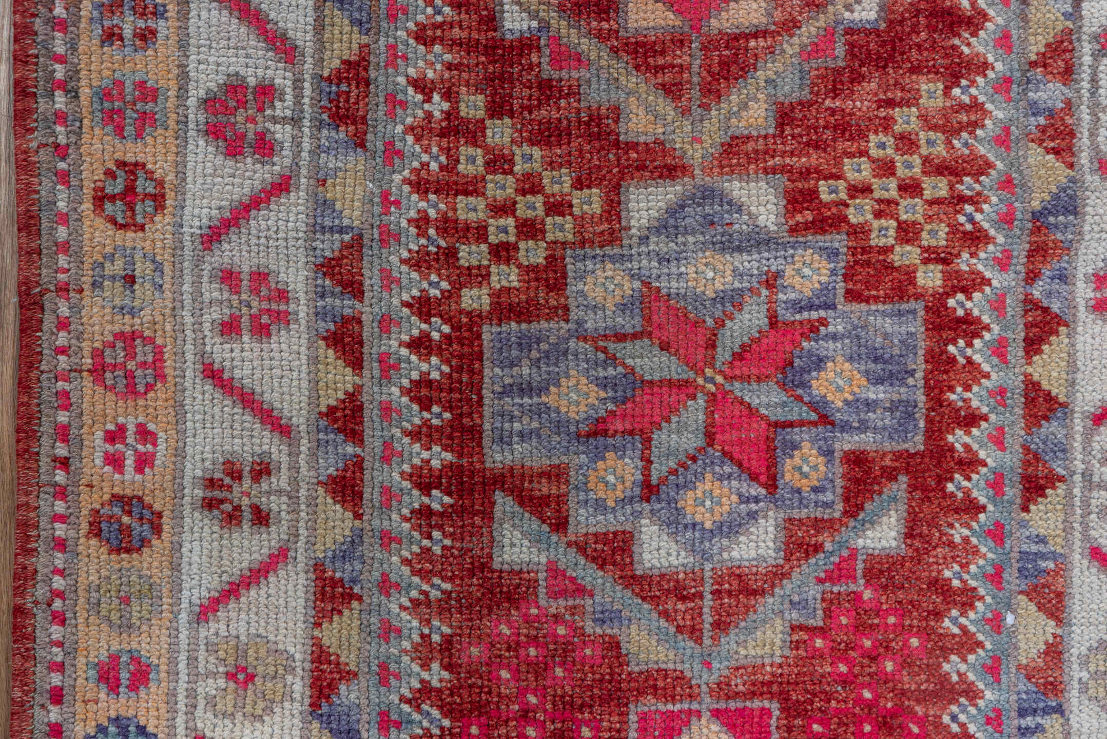 2' x 11' one-of-a-kind handmade vintage Oushak runner rug. Color palette: red, ivory, blue, pink, gold, rust, lavender