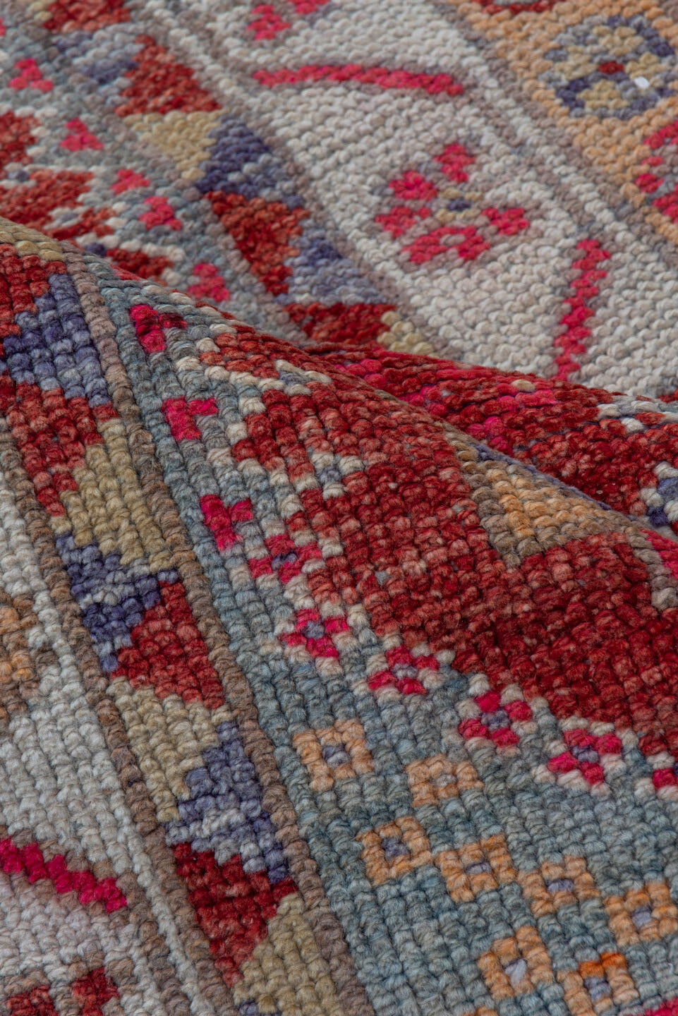 2' x 11' one-of-a-kind handmade vintage Oushak runner rug. Color palette: red, ivory, blue, pink, gold, rust, lavender