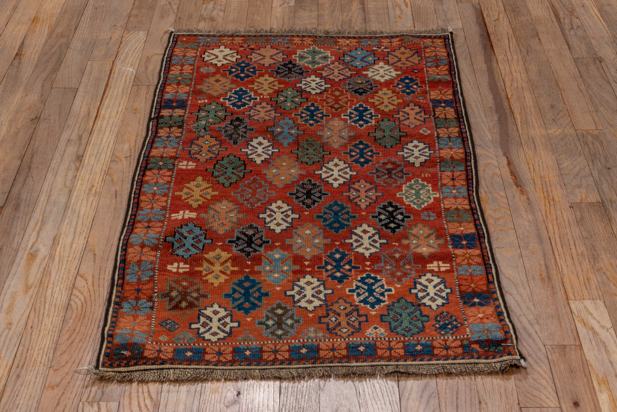 2' x 4' one-of-a-kind handmade vintage Shirvan small size rug. Color palette: black, brown, gray, pink, red