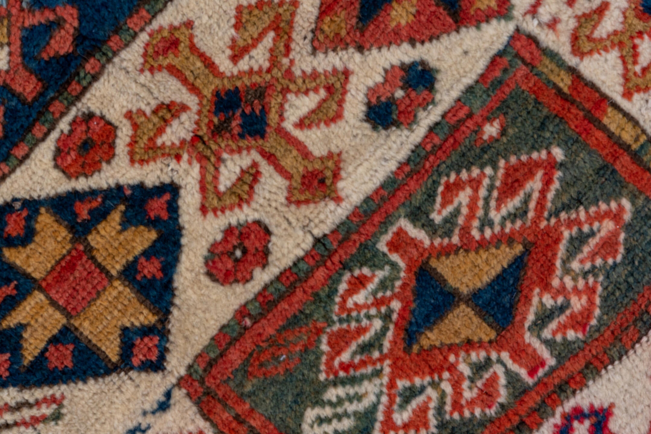 4' x 6' one-of-a-kind handmade vintage Kazak small size rug. Color palette: blue, brown, gray, pink, red