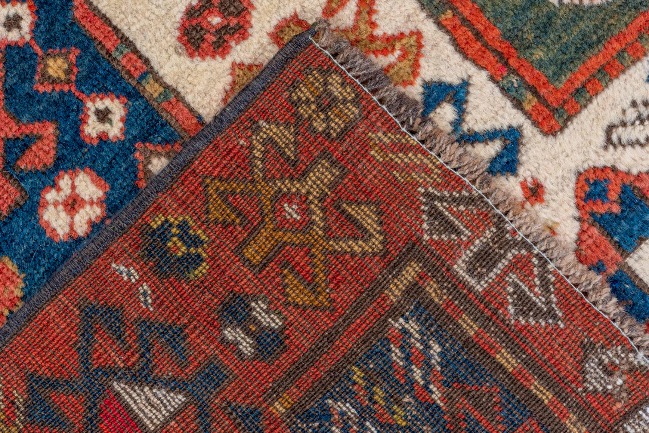 4' x 6' one-of-a-kind handmade vintage Kazak small size rug. Color palette: blue, brown, gray, pink, red