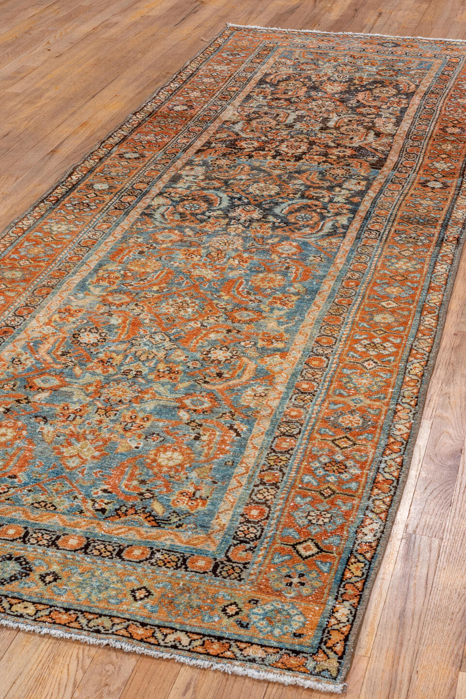 3' x 9' one-of-a-kind handmade vintage Malayer runner rug. Color palette: light blue, rust, ivory, navy, camel, charcoal