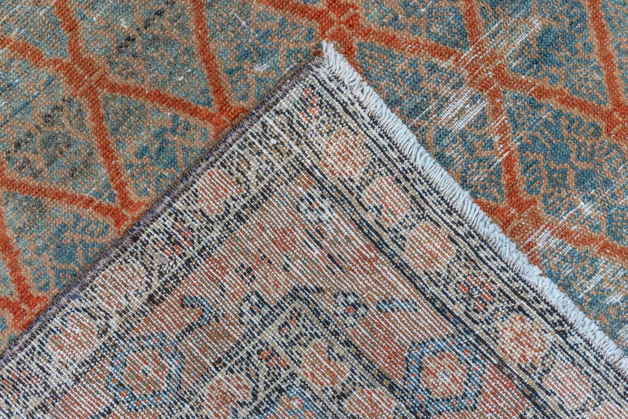 4' x 10' one-of-a-kind handmade vintage Malayer runner rug. Color palette: brown, pink, gray, light gray, blue, black