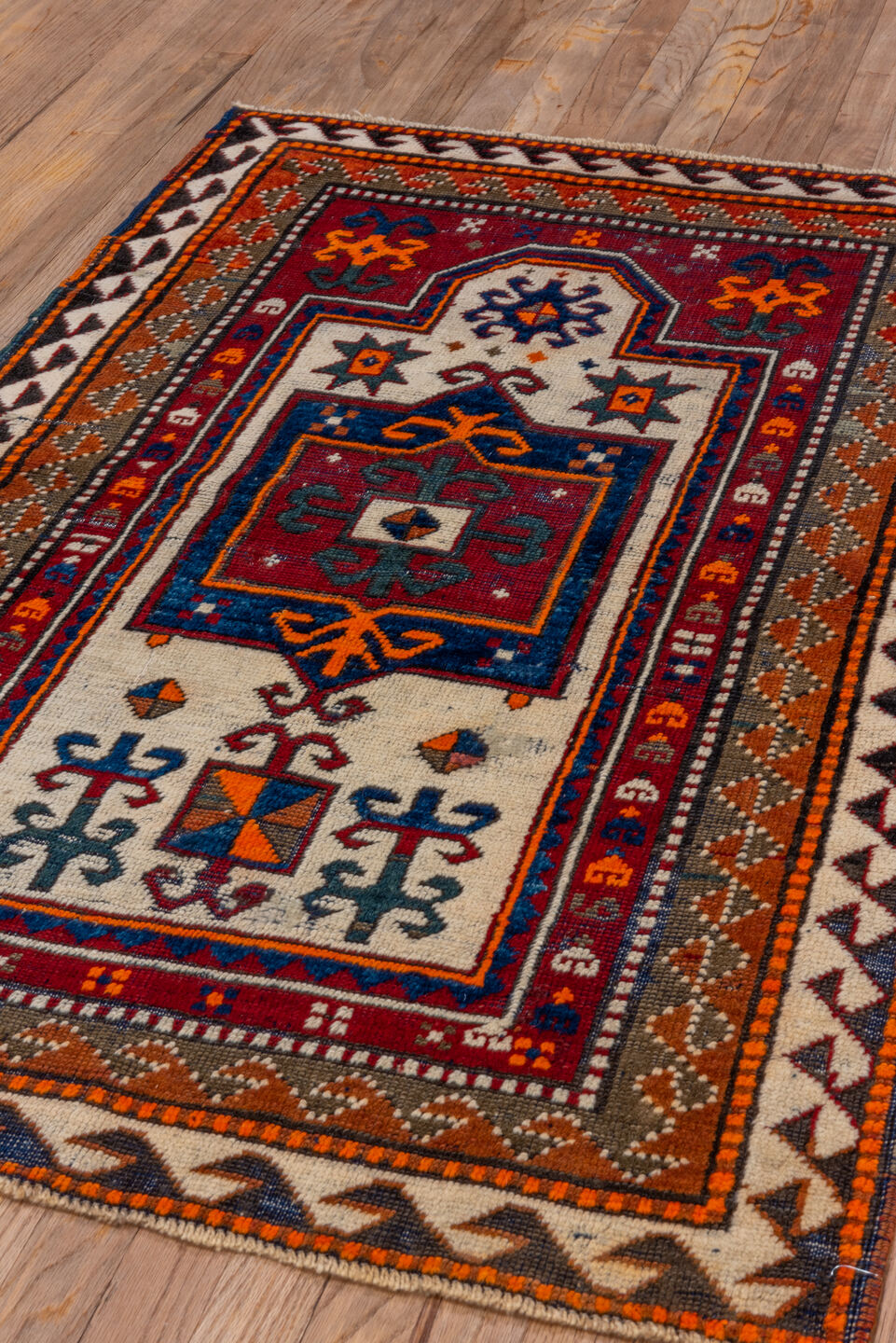 3' x 4' one-of-a-kind handmade vintage Kazak small size rug. Color palette: brown, gray, pink, red