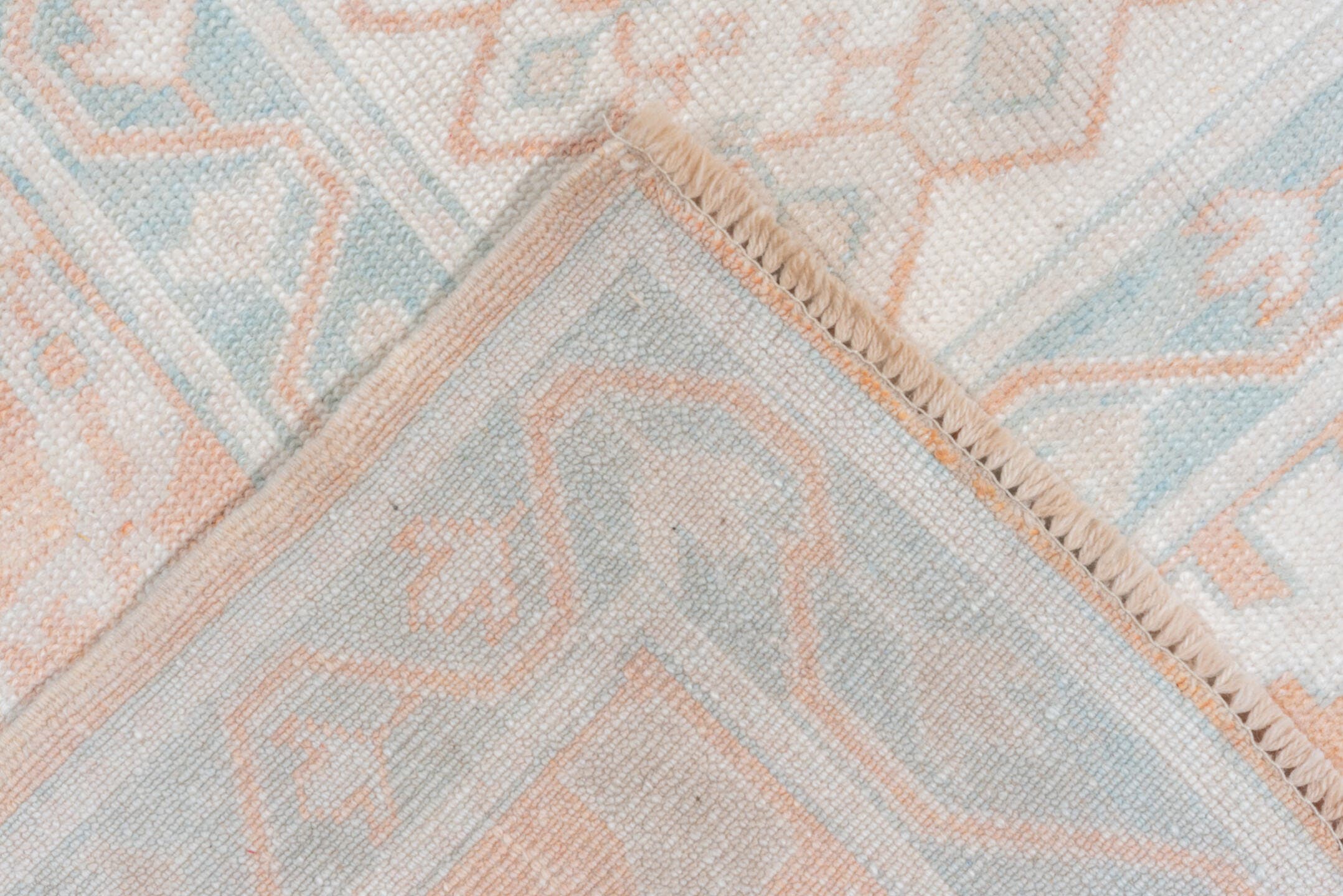 10' x 13' one-of-a-kind handmade vintage Oushak large size rug. Color palette: ivory, peach, aqua, sand, light blue, taupe