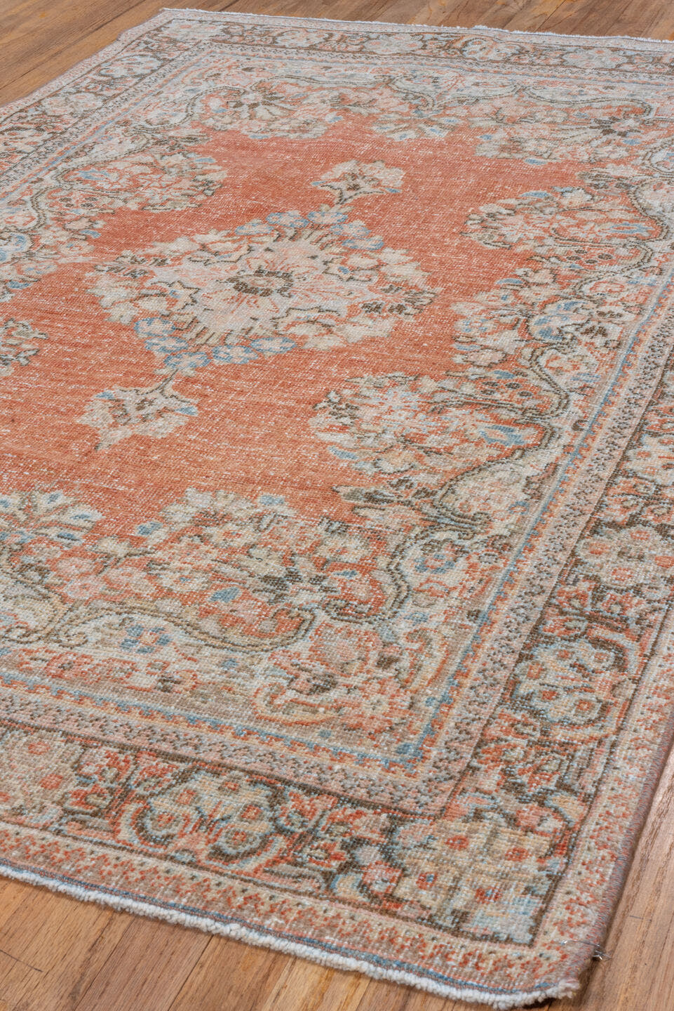 4' x 6' one-of-a-kind handmade vintage Mahal small size rug. Color palette: terra cotta, ivory, sky blue, charcoal, taupe