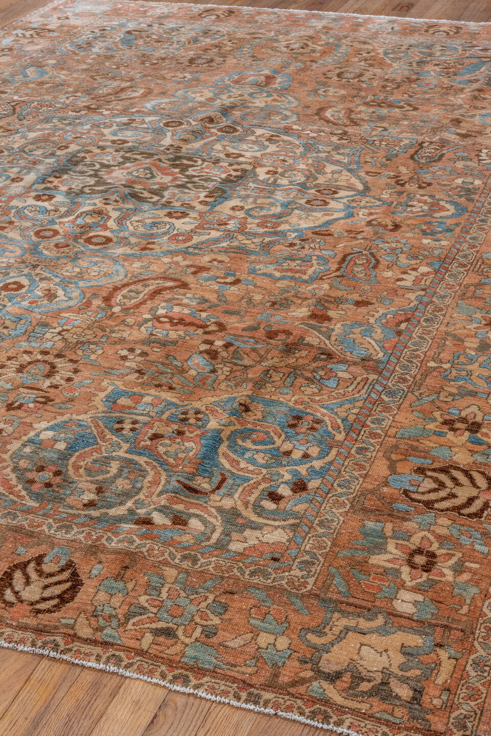 7' x 9' one-of-a-kind handmade vintage Baktiary rug. Color palette: terra cotta, sky blue, ivory, brown, camel, slate